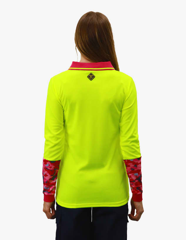 A bright yellow polo shirt with long sleeves featuring a red and pink camo pattern on the sleeves. Includes a logo on the back.