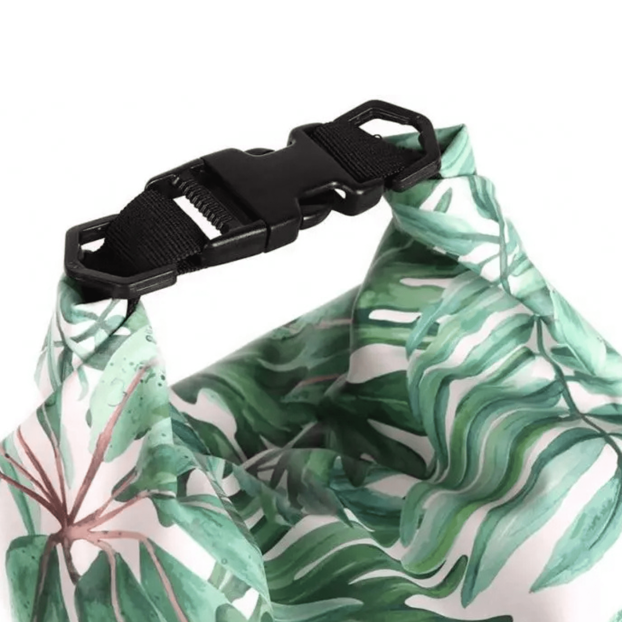 A waterproof dry bag featuring a tropical leaf design and a black buckle closure. It has a vibrant green and white colour scheme.