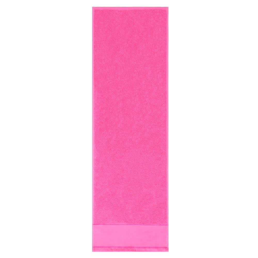 A pink gym towel with a soft texture and a branding logo at the bottom.
