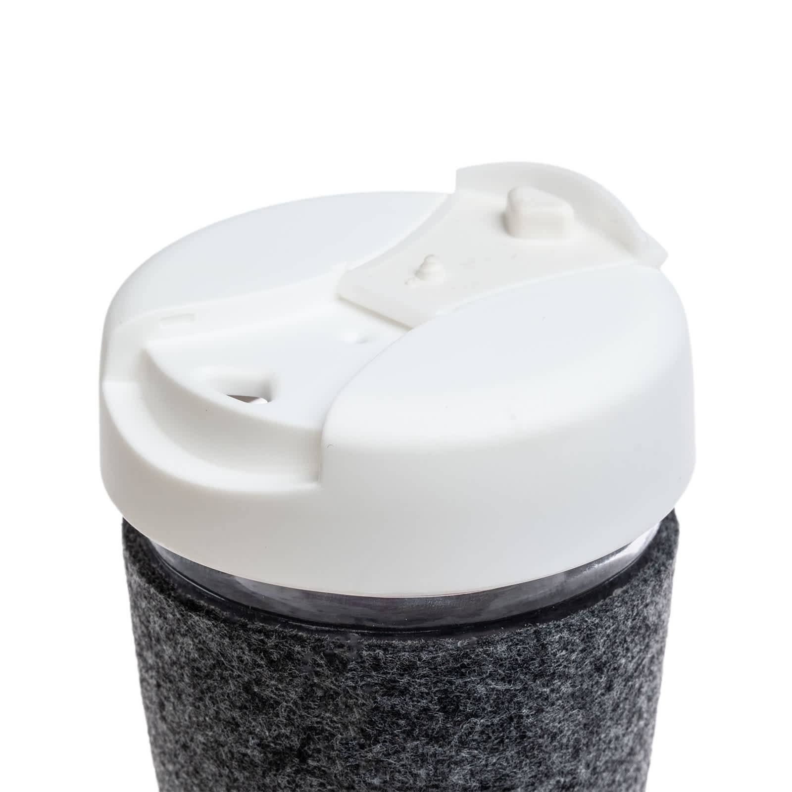A coffee cup with a flip lid and a textured RPET band in a dark color, designed for reusable drinkware.