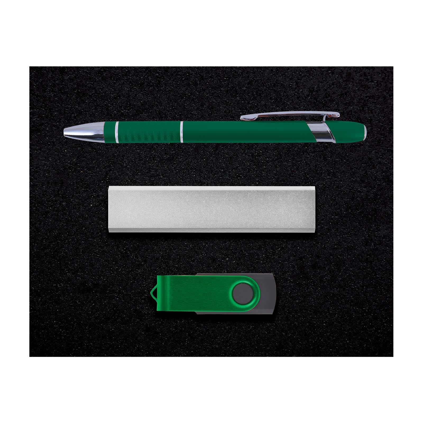 A green pen, silver business card holder, and green USB flash drive on a dark background.