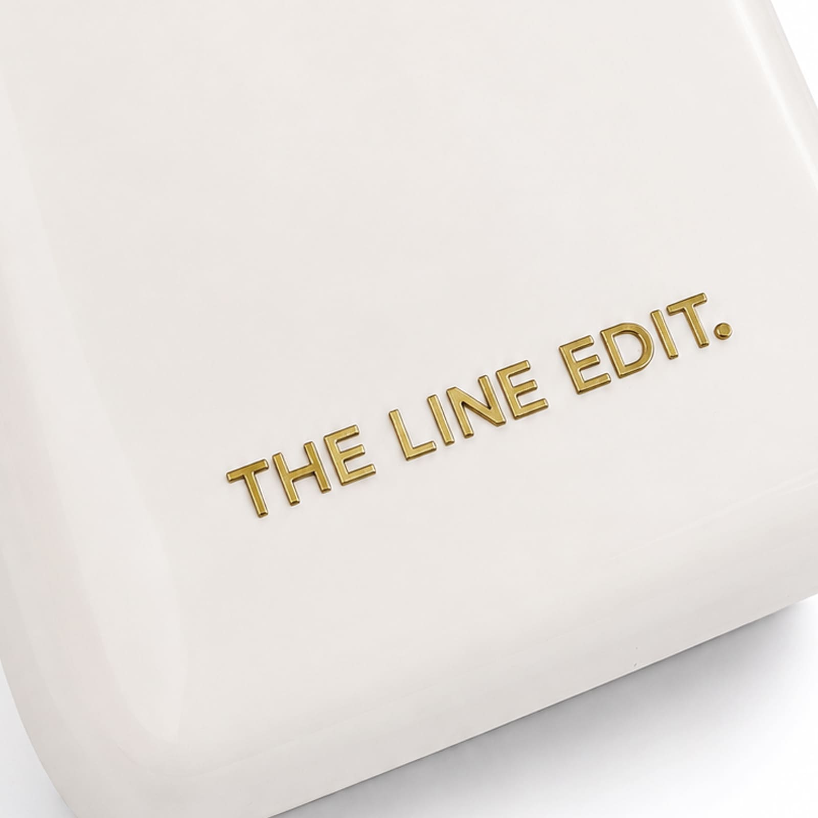 A cream cooler featuring a simple, sleek design with a gold logo.