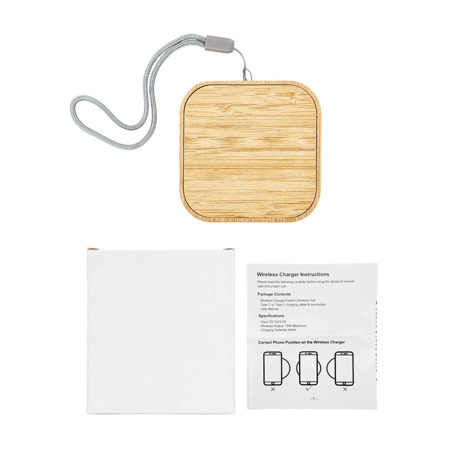 A square wireless charger with a bamboo finish and a grey strap, alongside a white box and instruction manual.