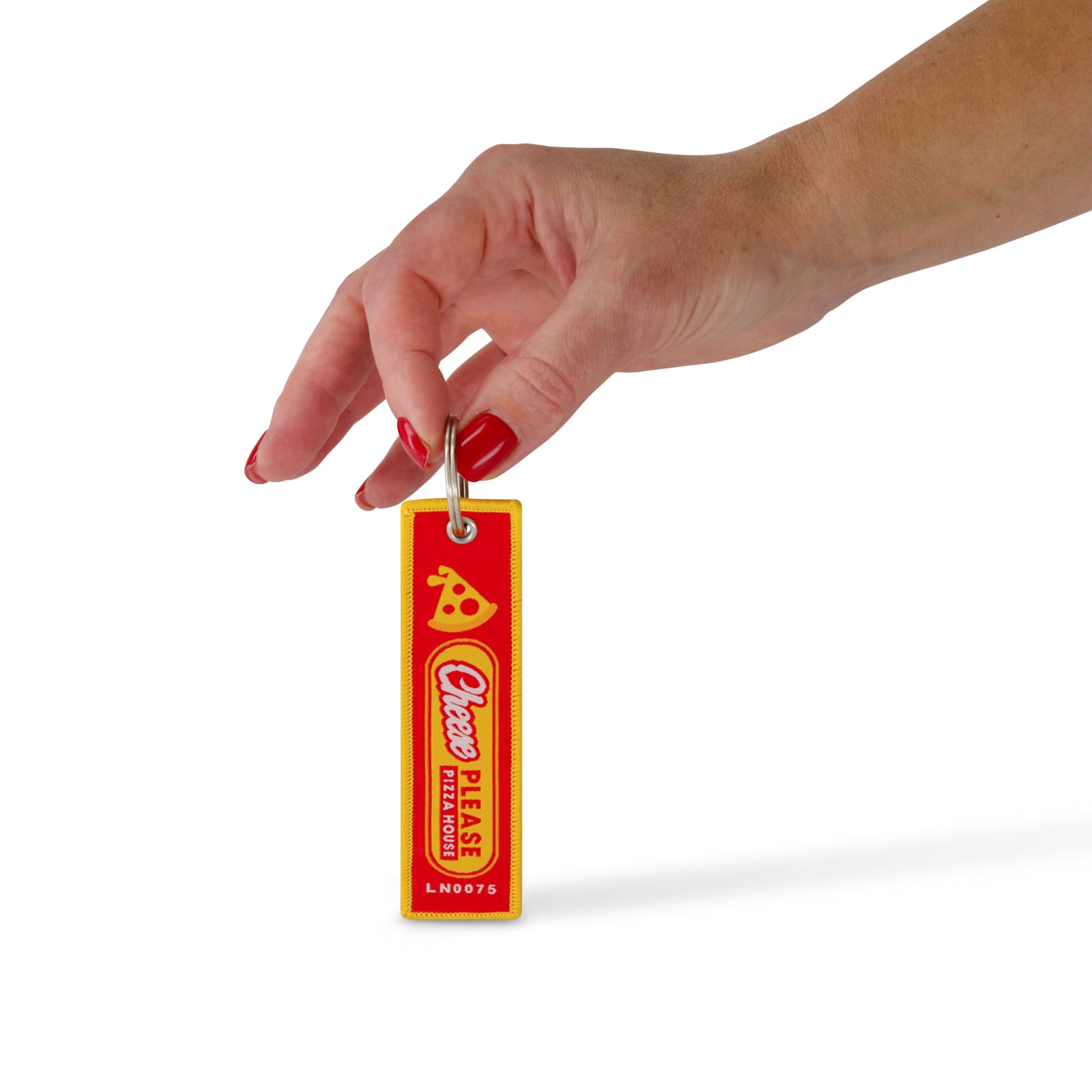 A hand holds a red and yellow woven keytag with a logo, featuring a pizza design.