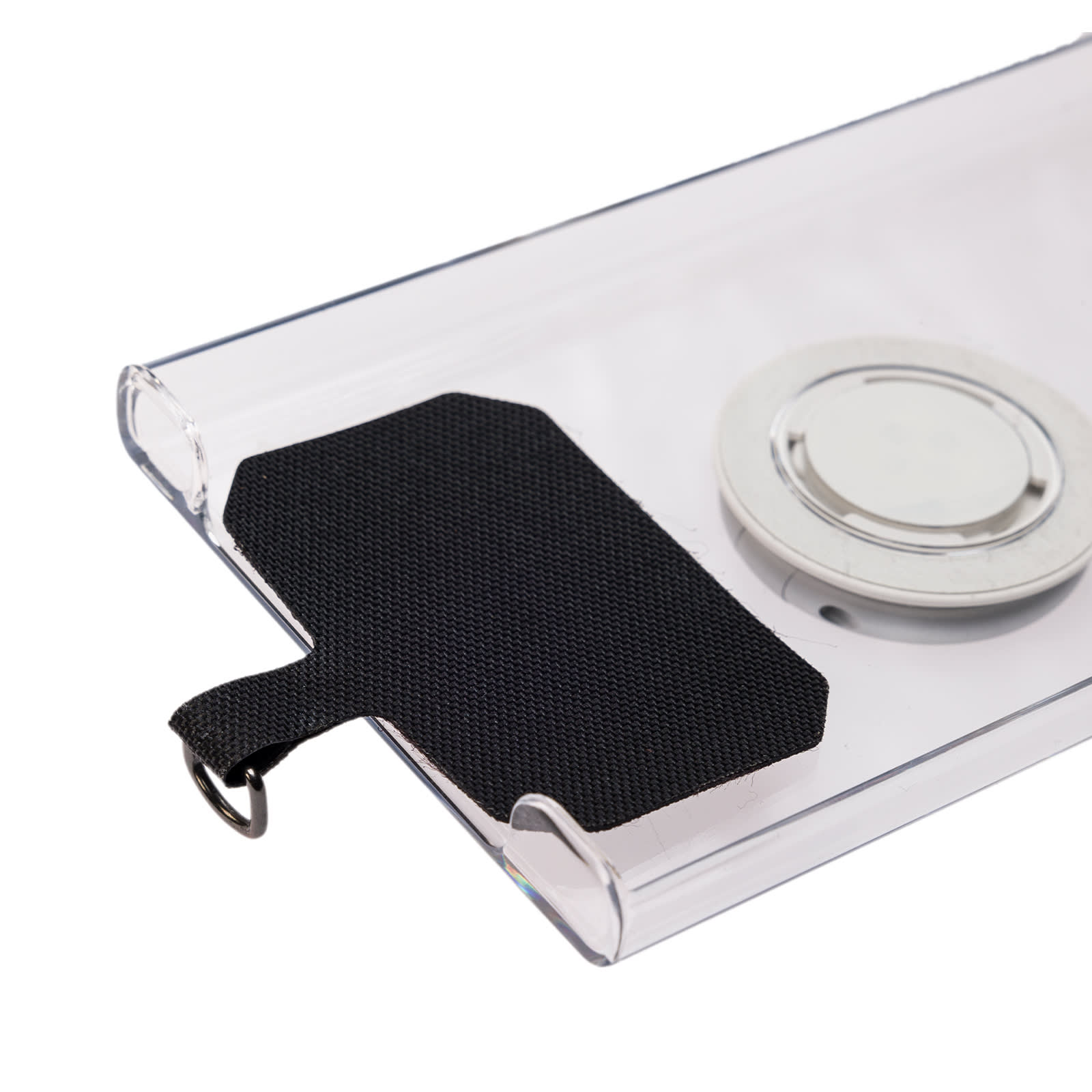 A clear phone lanyard with a black fabric loop, featuring a circular magnetic attachment.