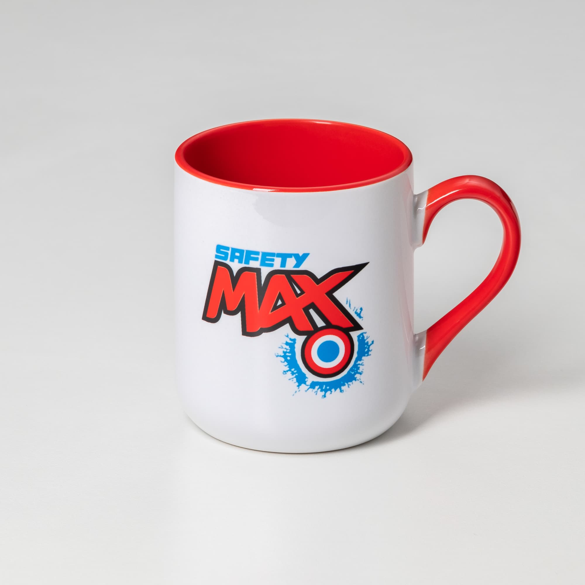 A white coffee mug with a red handle and interior, featuring a logo on the side.