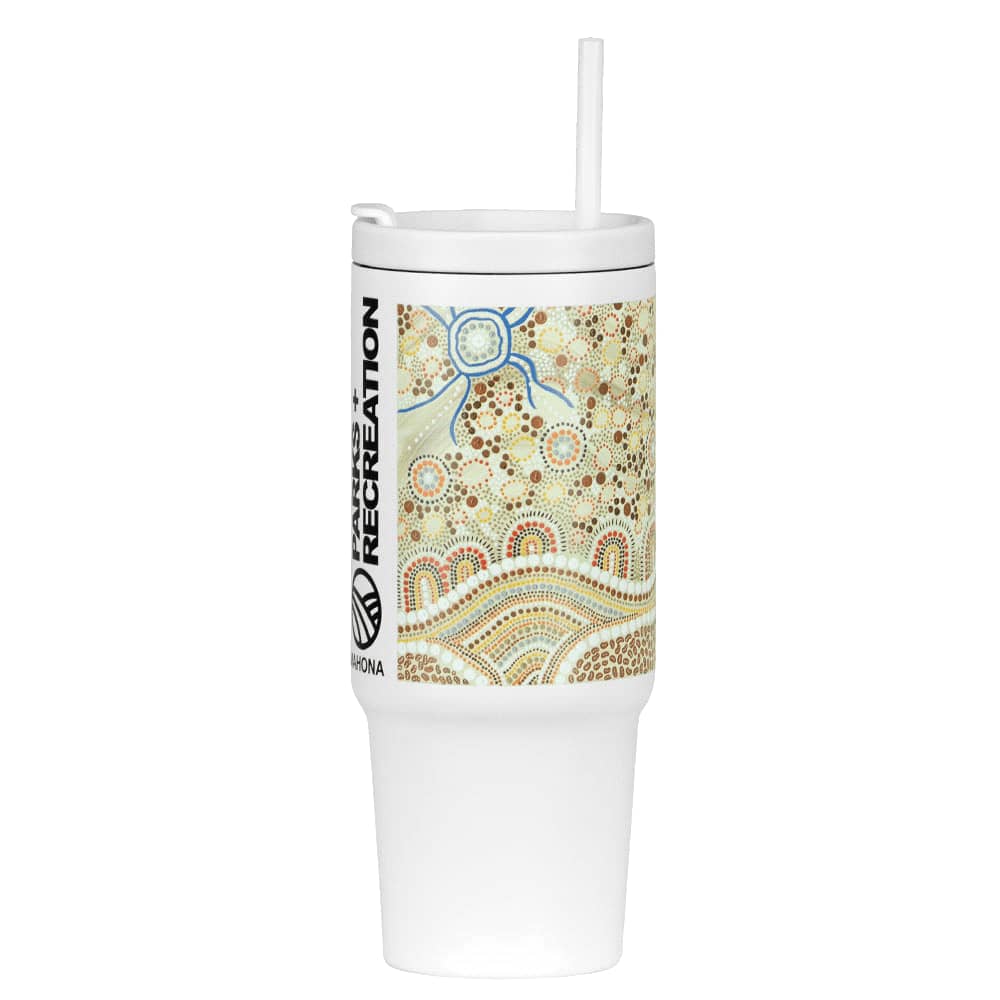 A drink bottle featuring a white base with a decorative Aboriginal-inspired design and a straw. It has a logo.