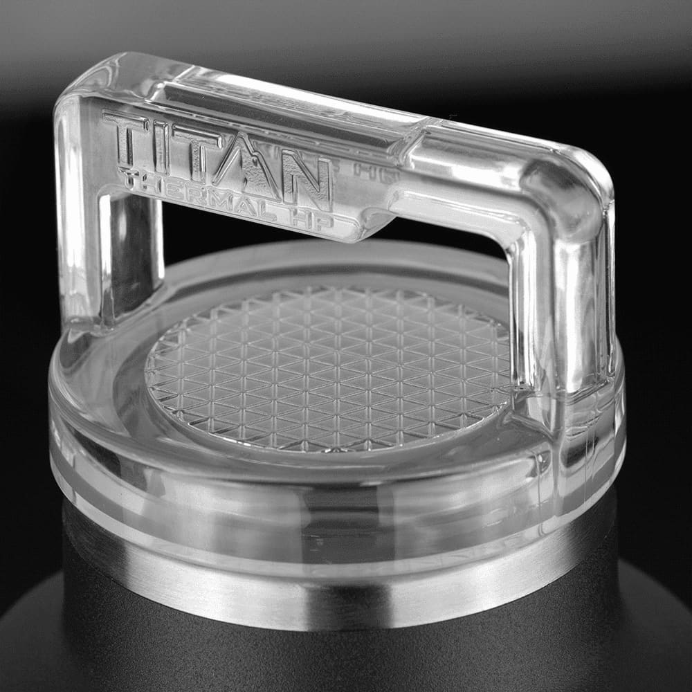 A drink bottle with a clear, textured lid and a black body, featuring a logo on the lid.