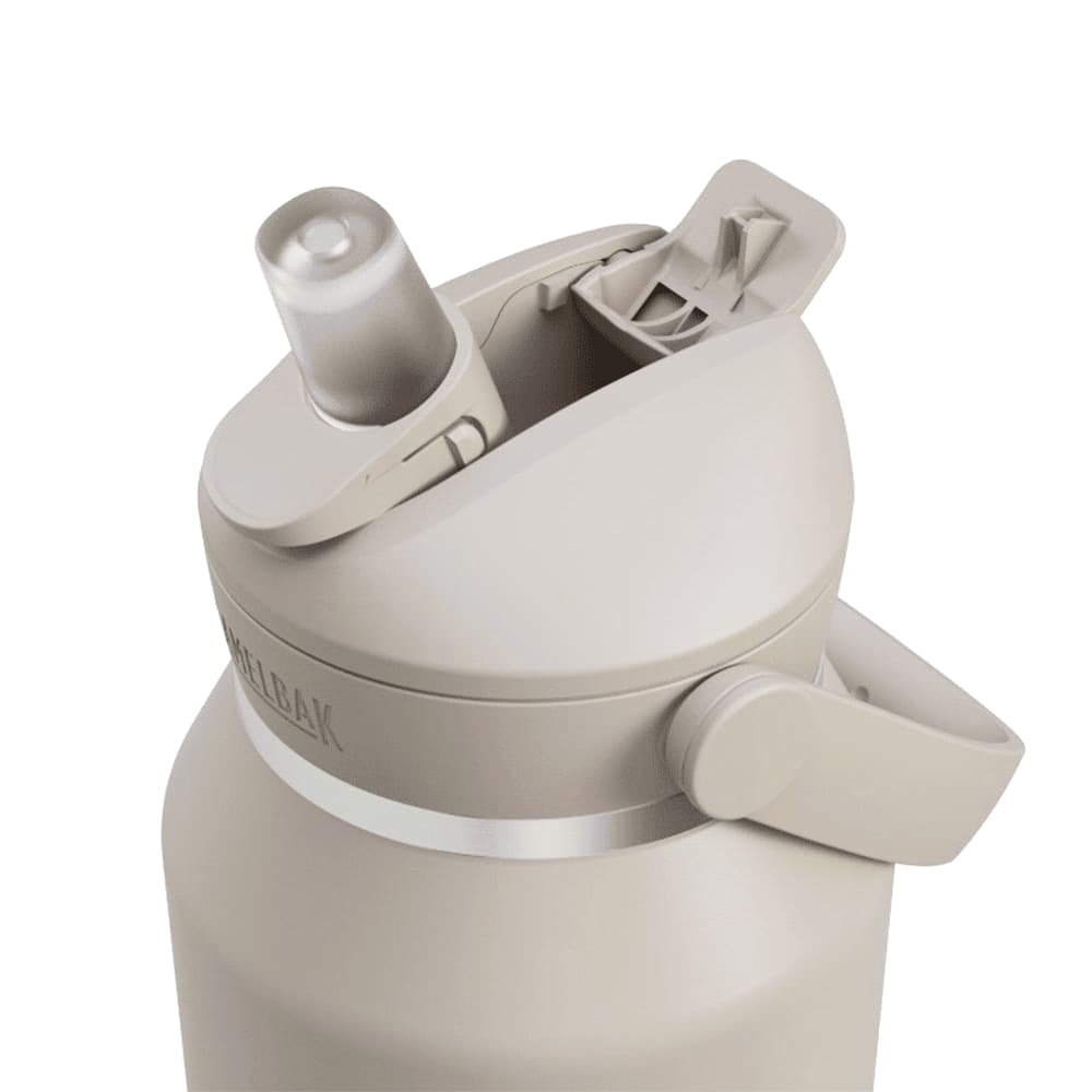 A drink bottle in beige with a flip straw lid and a side handle, featuring a logo.