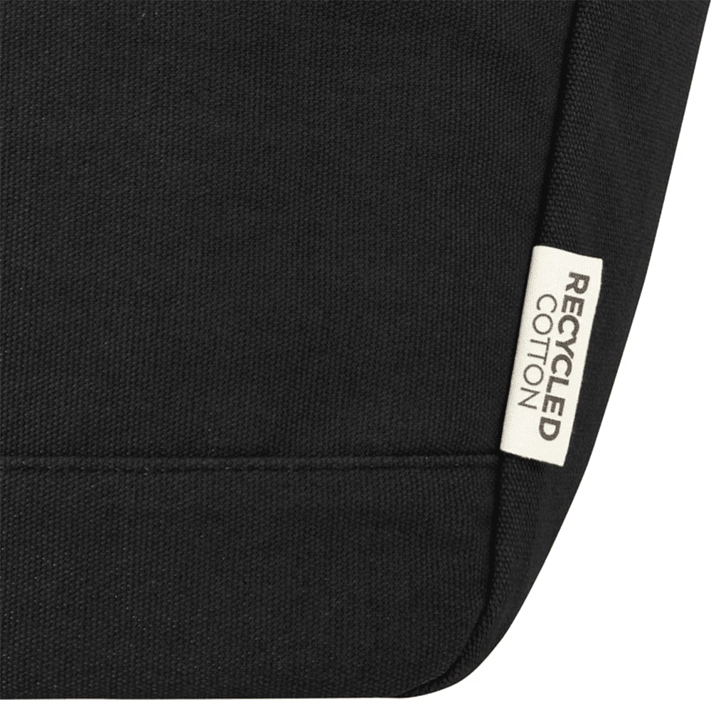 A black cooler tote featuring a recycled cotton label and a simple, sleek design.