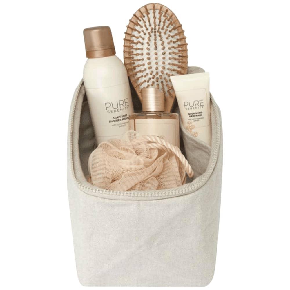 A beige toiletry organiser containing hair products, a hairbrush, and a shower loofah. It has a simple design and a logo.