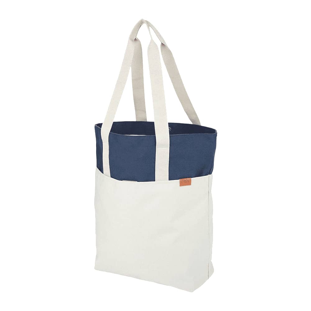 A tote bag featuring a navy blue top section and a cream-coloured lower section, with long handles and a logo.