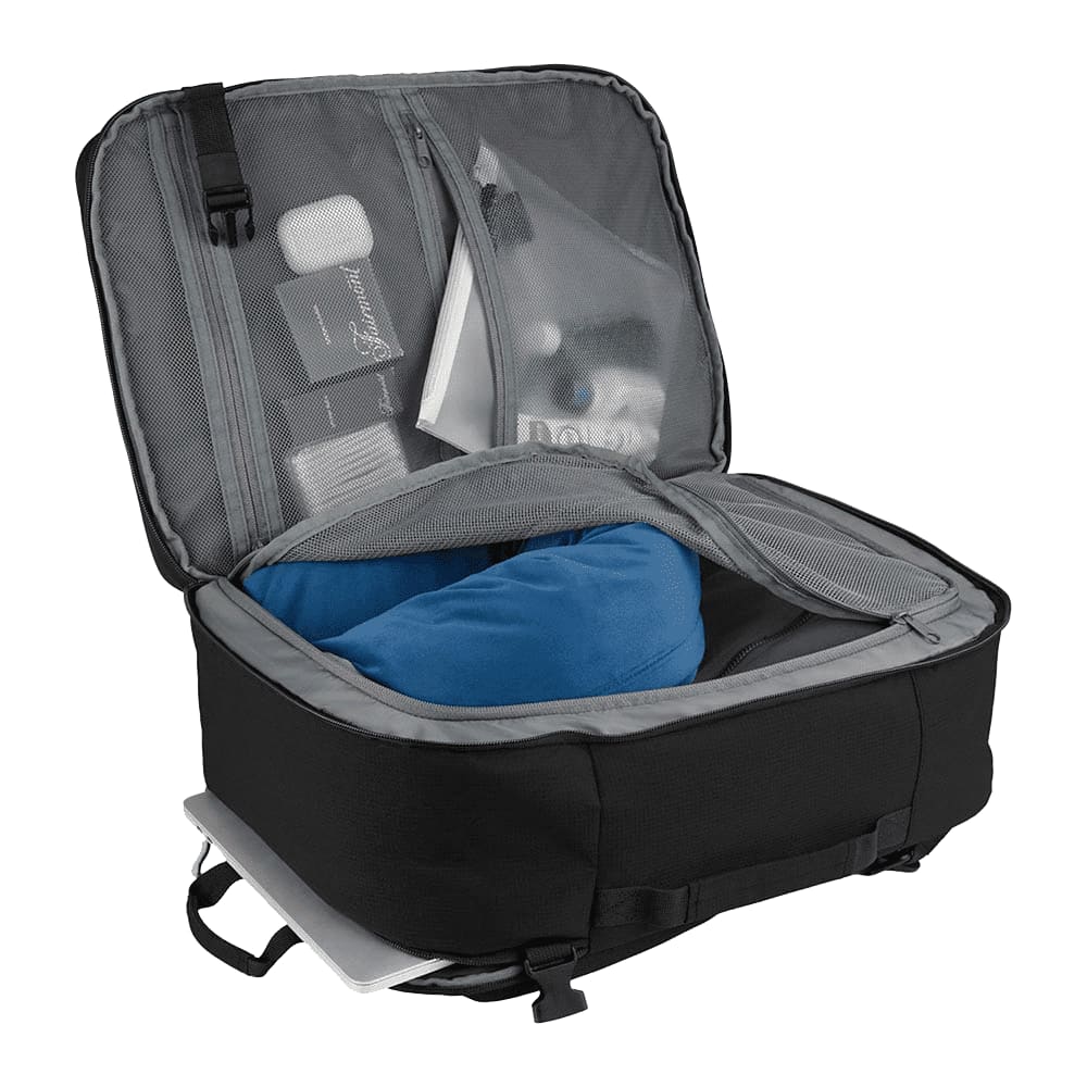 A black travel backpack with grey lining, featuring compartments for a blue pillow and various travel essentials.