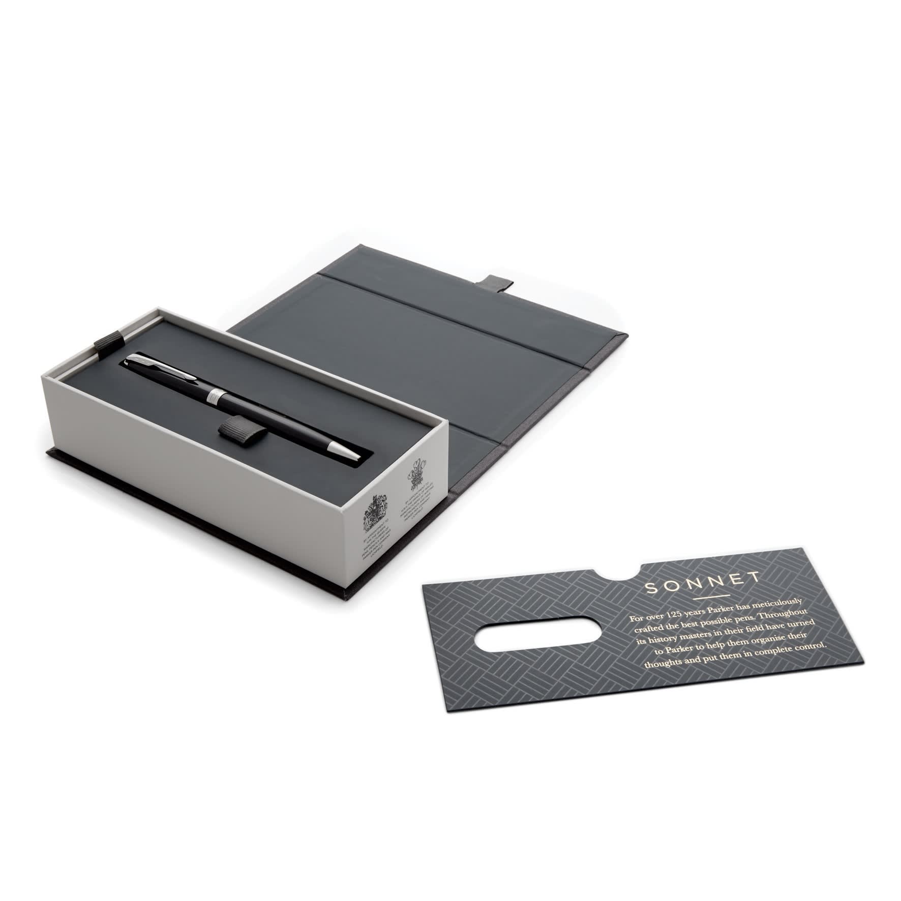 A black lacquer ballpoint pen in a sleek box with a card. The box has an elegant grey interior and a subtle logo.