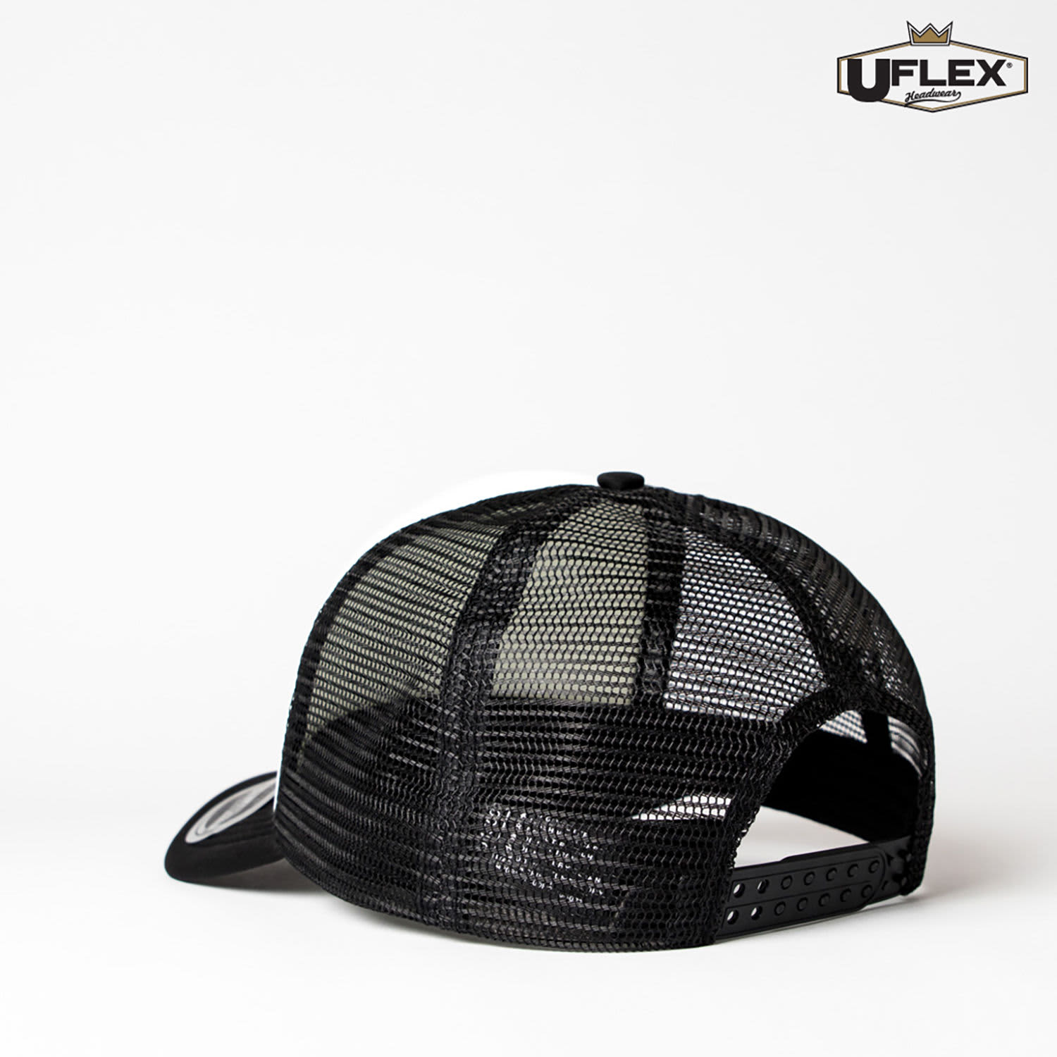 A black Snap Back Trucker cap with a mesh back and an adjustable strap, featuring a logo.