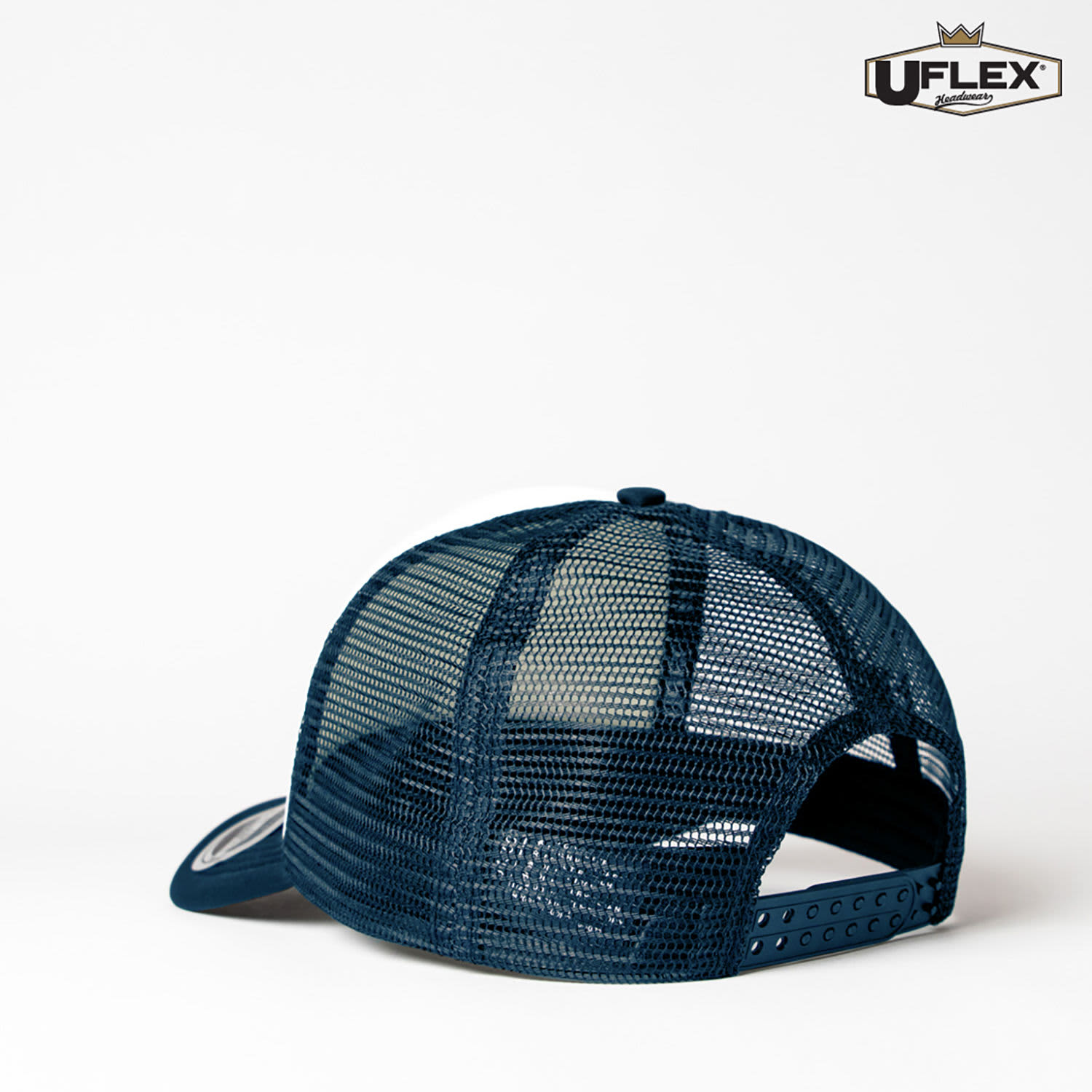 A navy blue Snap Back Trucker cap with a mesh back and an adjustable strap, featuring a logo on the front.