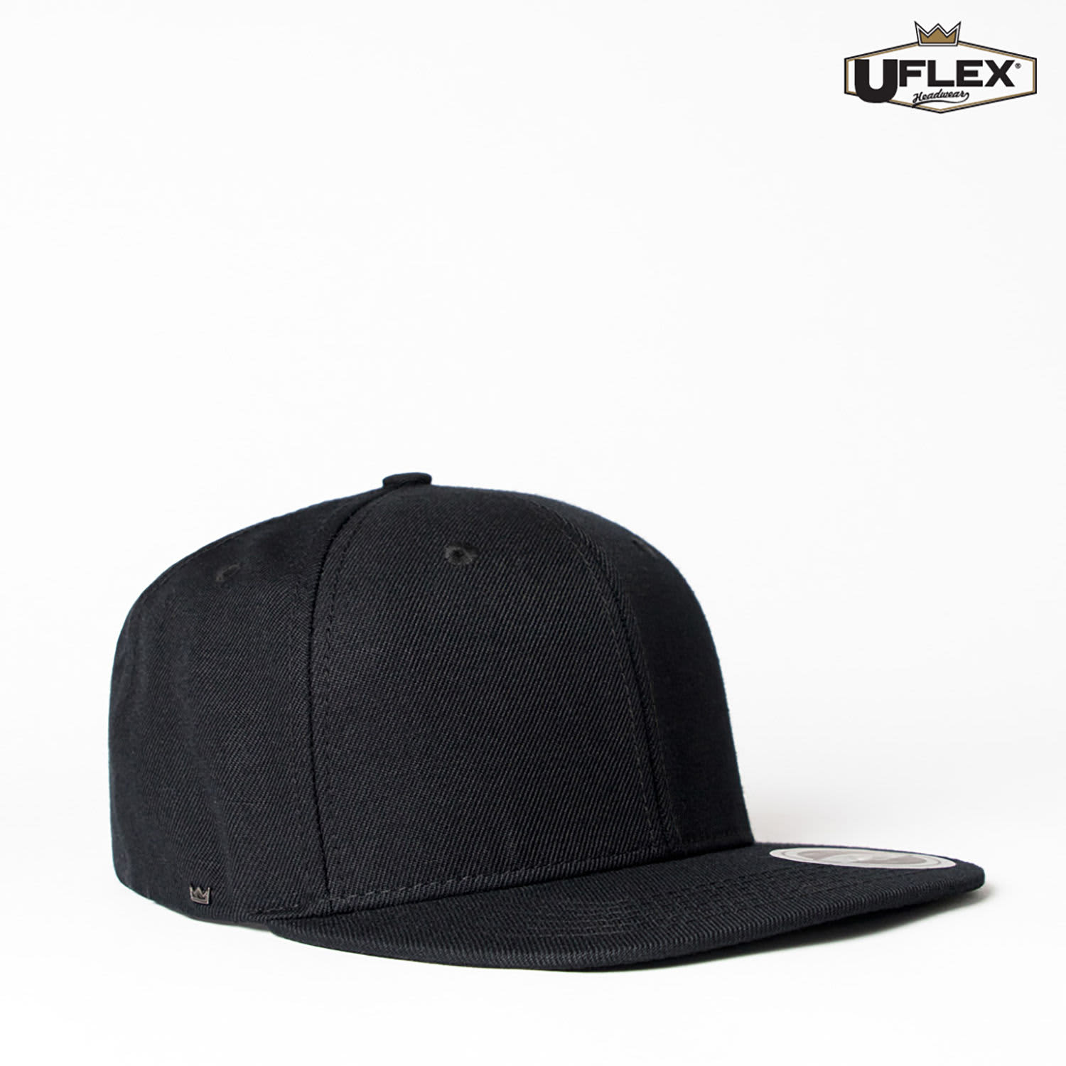 A black snapback cap with a structured crown, featuring a logo on the side.