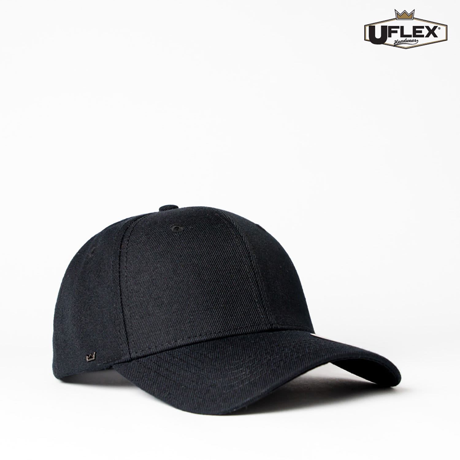 A black six-panel snapback cap with a logo, featuring a curved brim and a classic design.