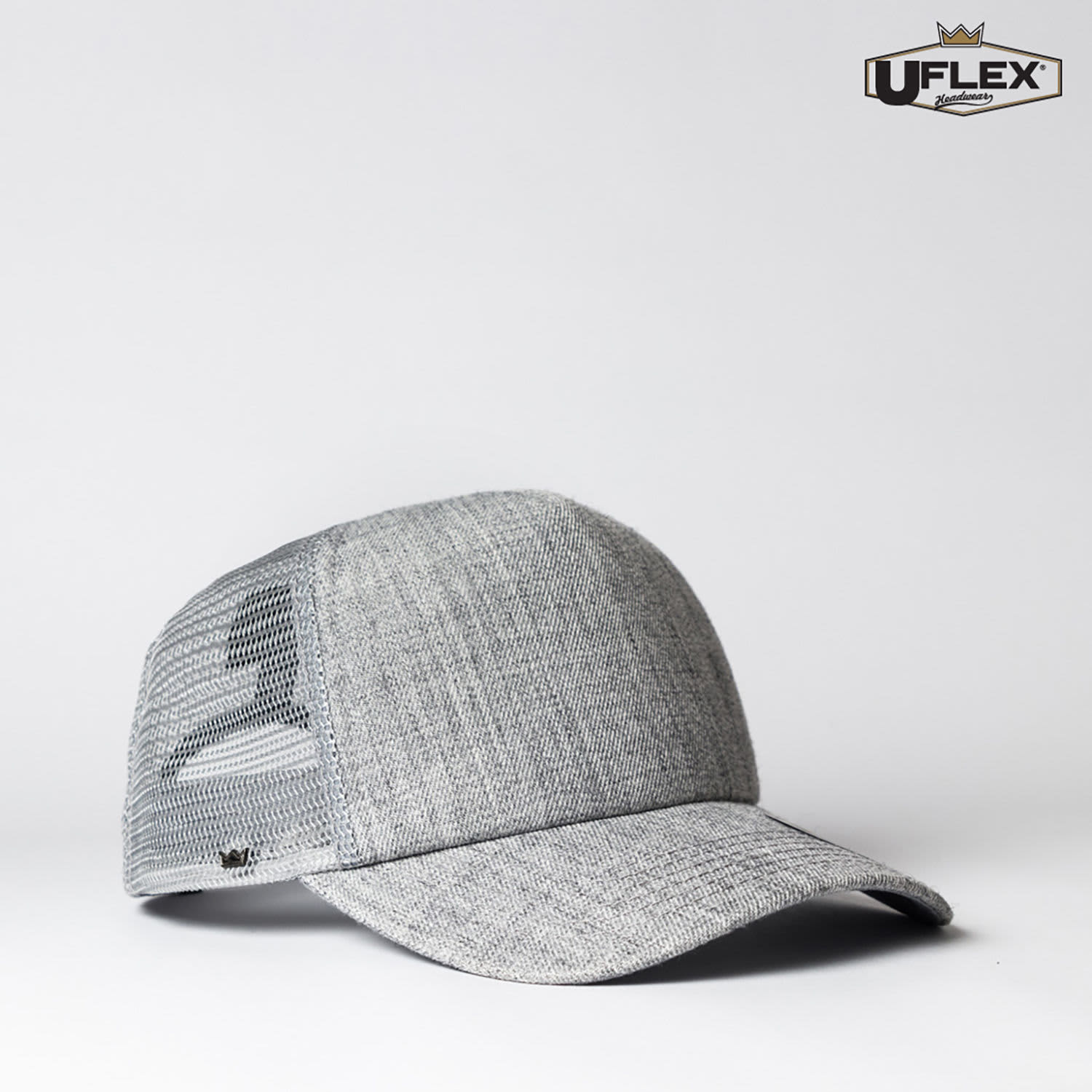A grey trucker cap with a mesh back and an adjustable fit, featuring a branding logo.