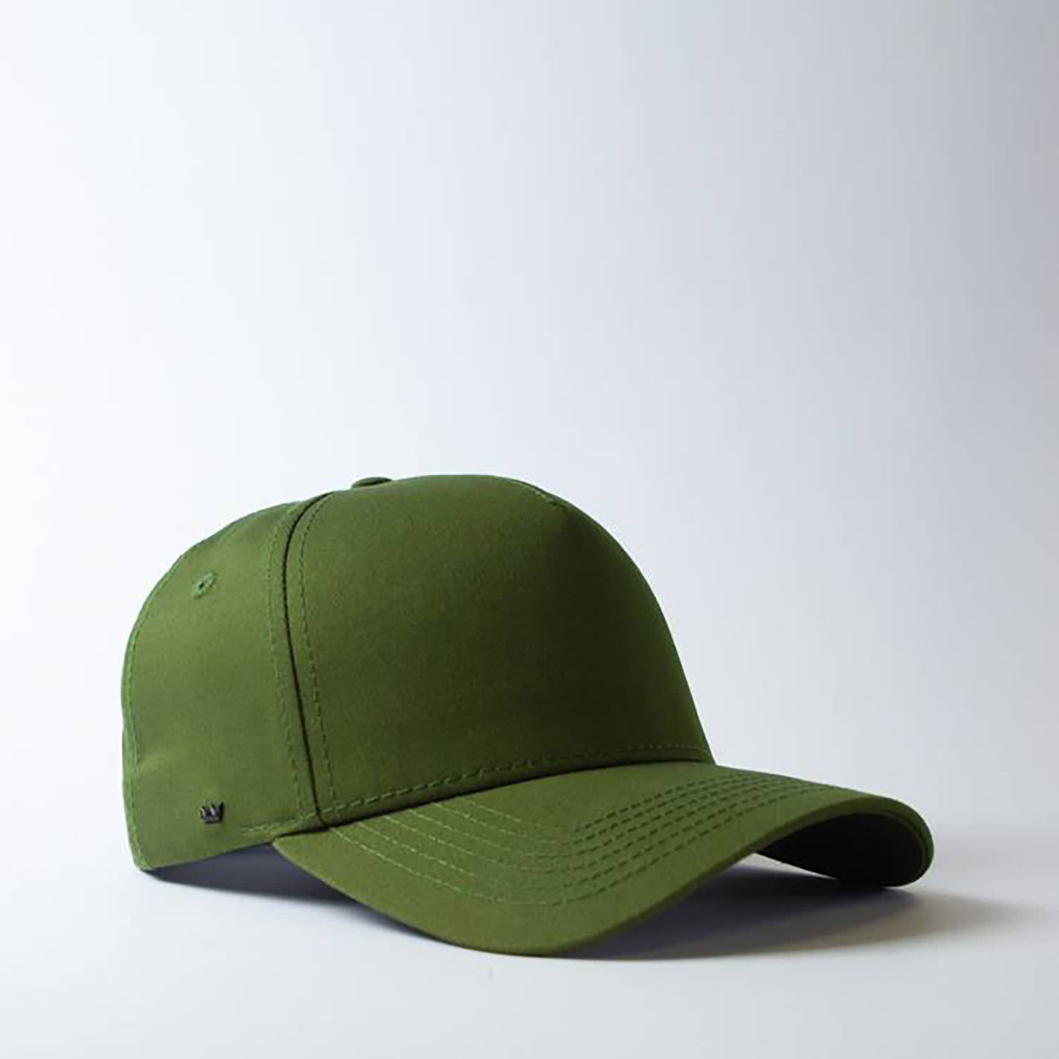 A green snapback cap with a five-panel design and a branded logo on the side.