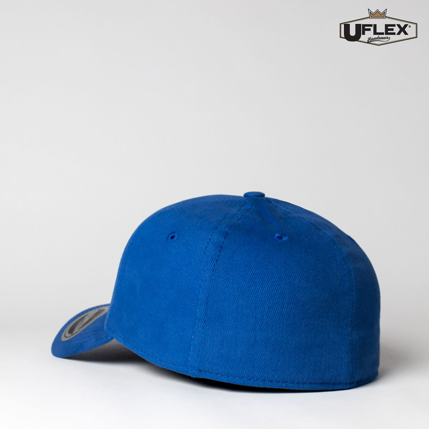 A blue fitted cap with a rounded peak and a logo on the side.