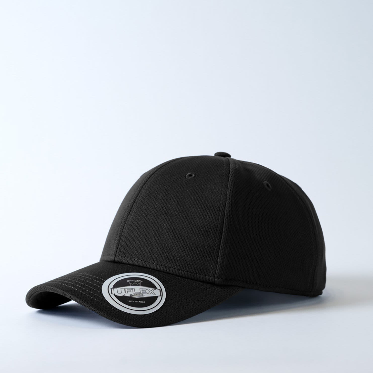 A black recycled polyester cap with a fitted design and a branded tag on the front.
