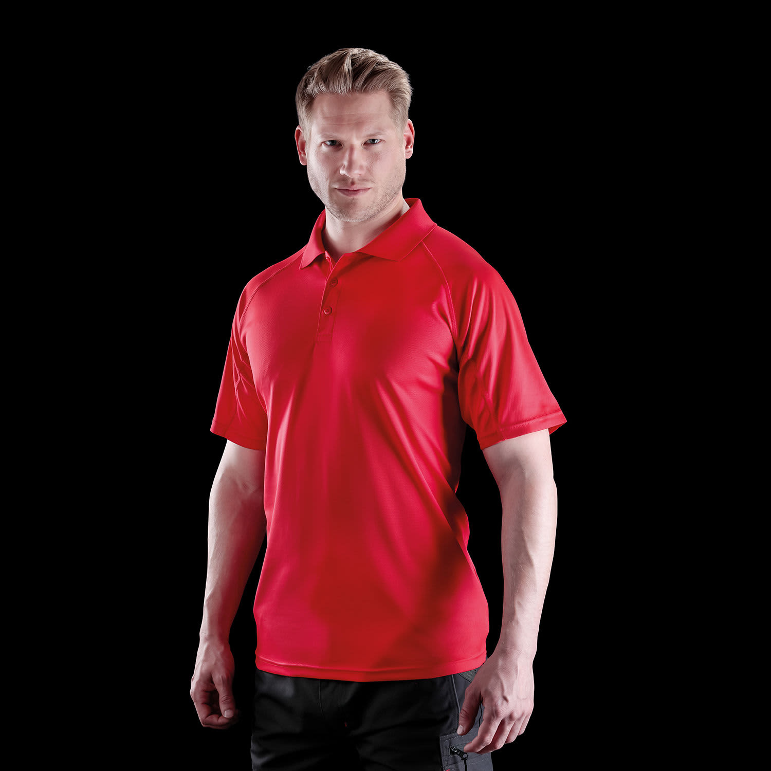 A red polo shirt with short sleeves and a collar, featuring a logo on the chest.