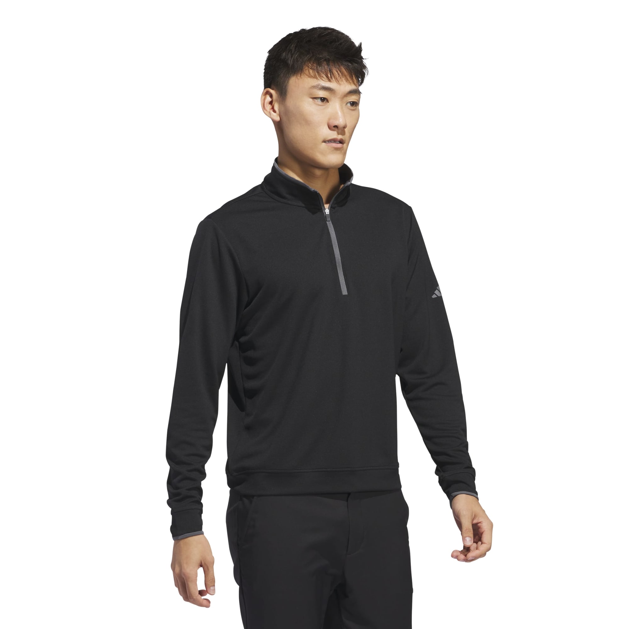 A black quarter zip pullover for men, featuring a collar and long sleeves, designed for lightweight comfort.