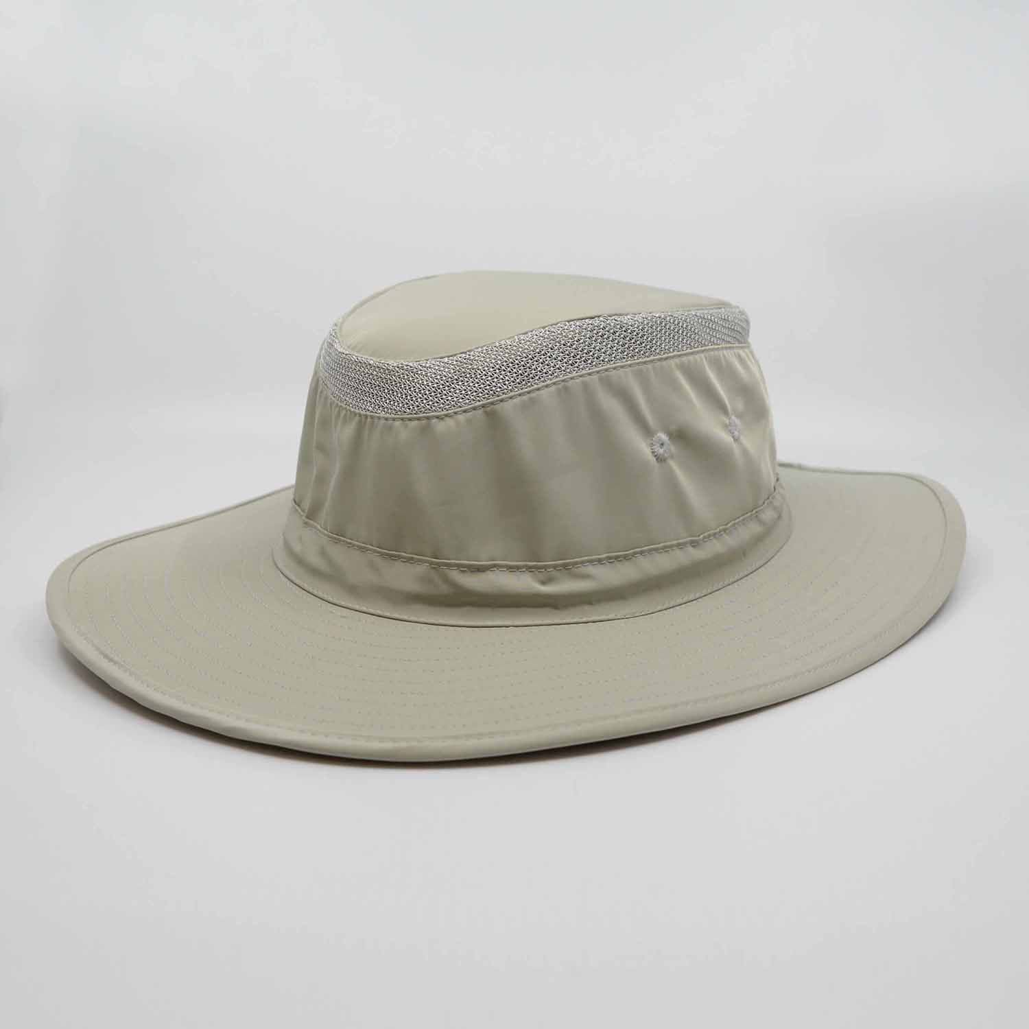 A light khaki sun hat with a wide brim and mesh detailing, featuring a logo.