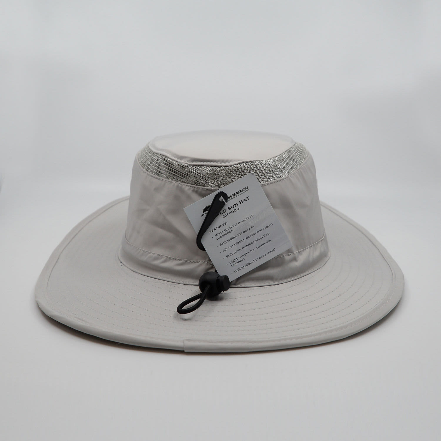 A light grey sun hat with a wide brim, featuring a chin strap and a label attached.