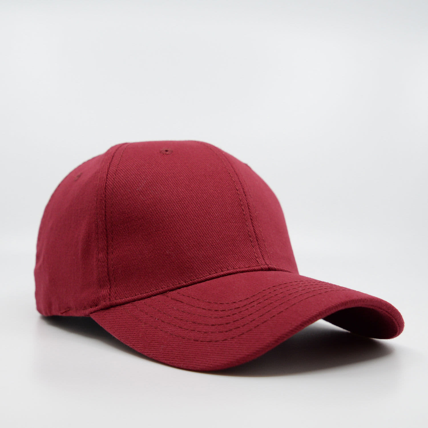 A maroon six-panel brushed cotton cap with a curved brim and a logo on the front.