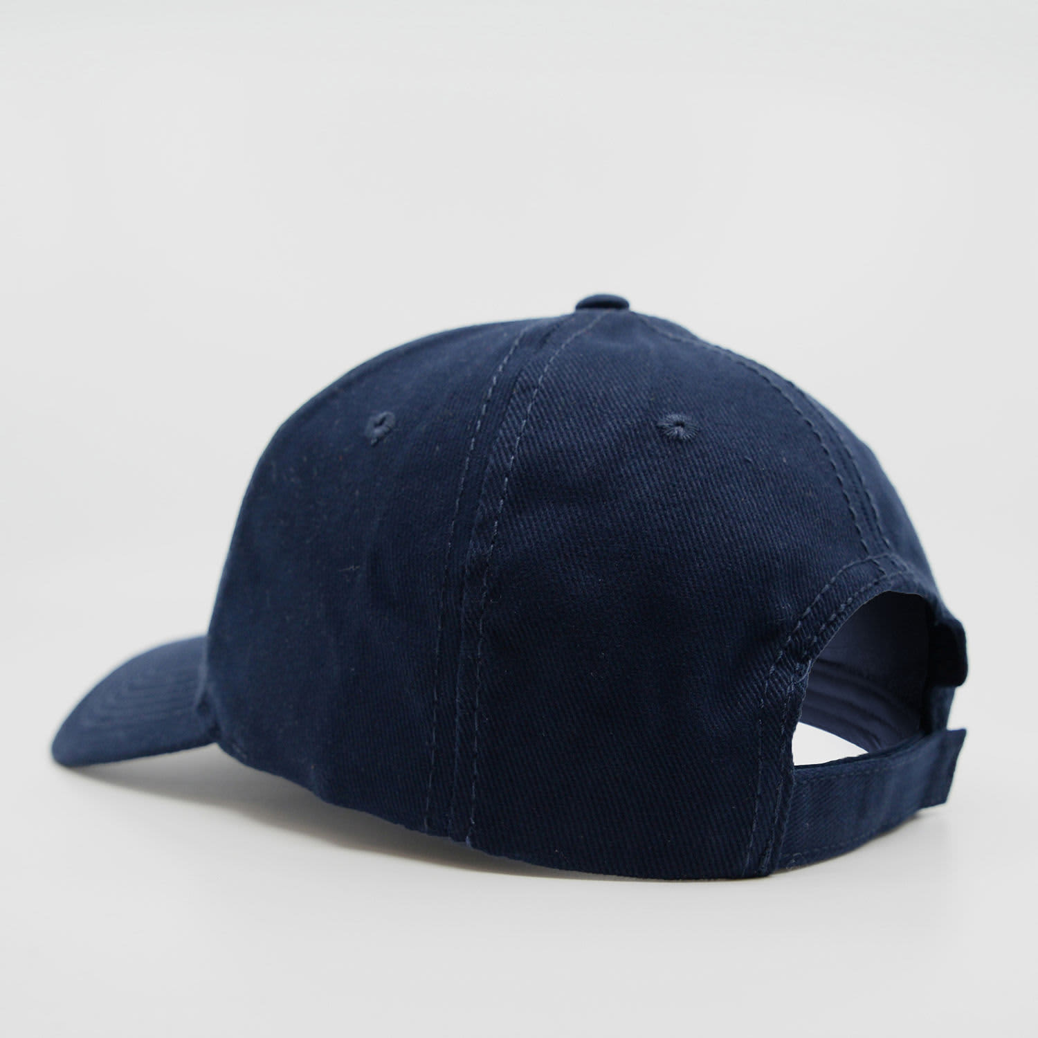 A navy blue six-panel brushed cotton cap featuring an adjustable strap and a logo on the back.