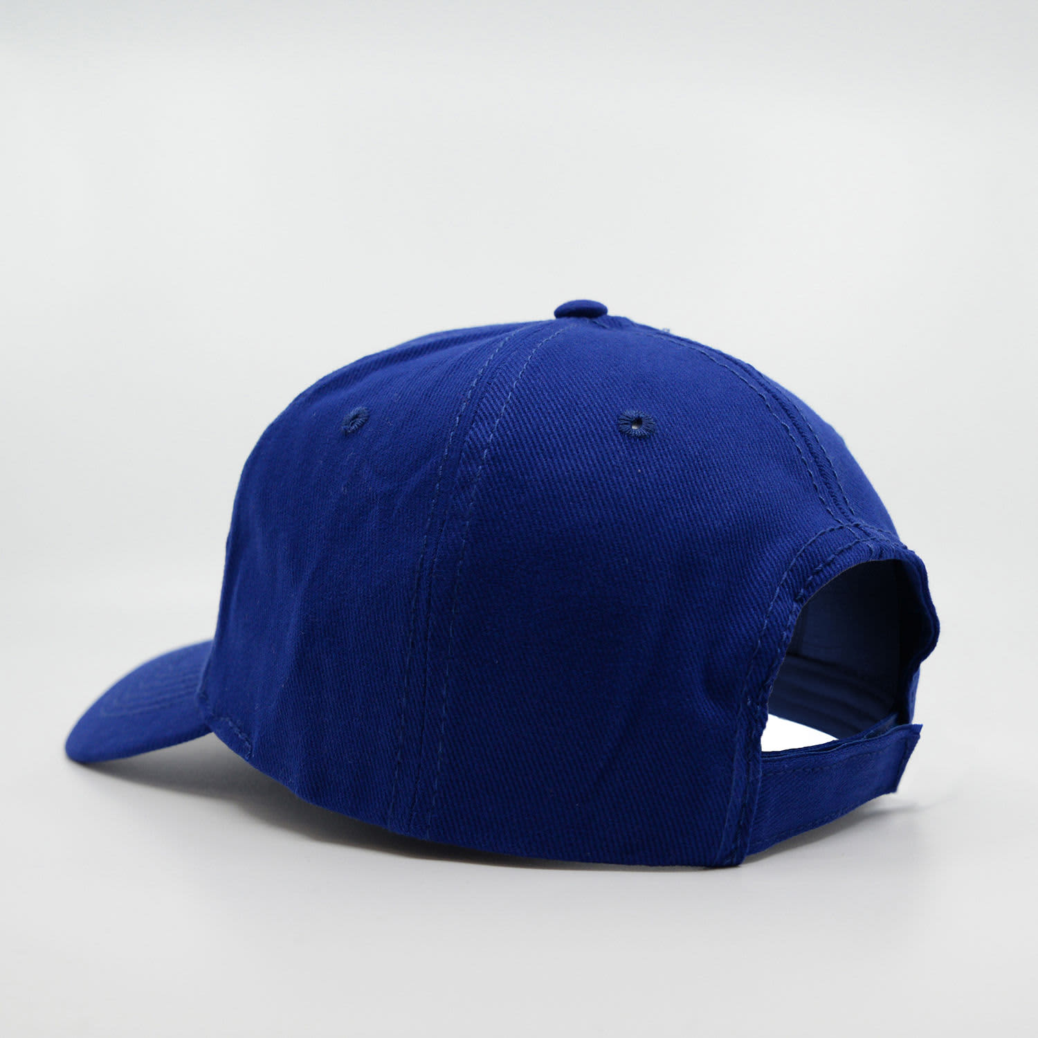 A blue 6-panel brushed cotton cap with a back opening and a logo on the side.