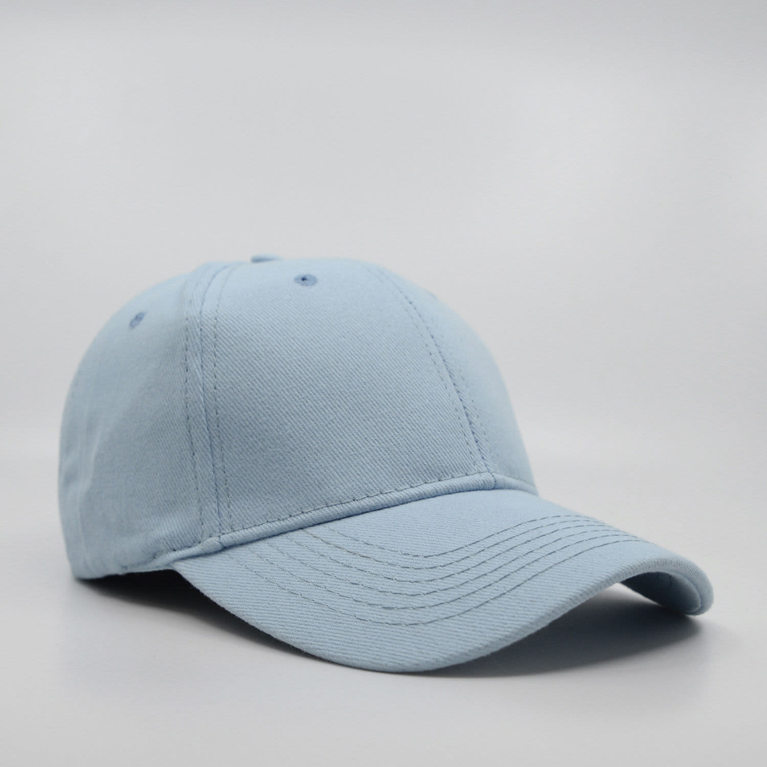 A light blue six-panel brushed cotton cap with a curved brim and a logo on the front.