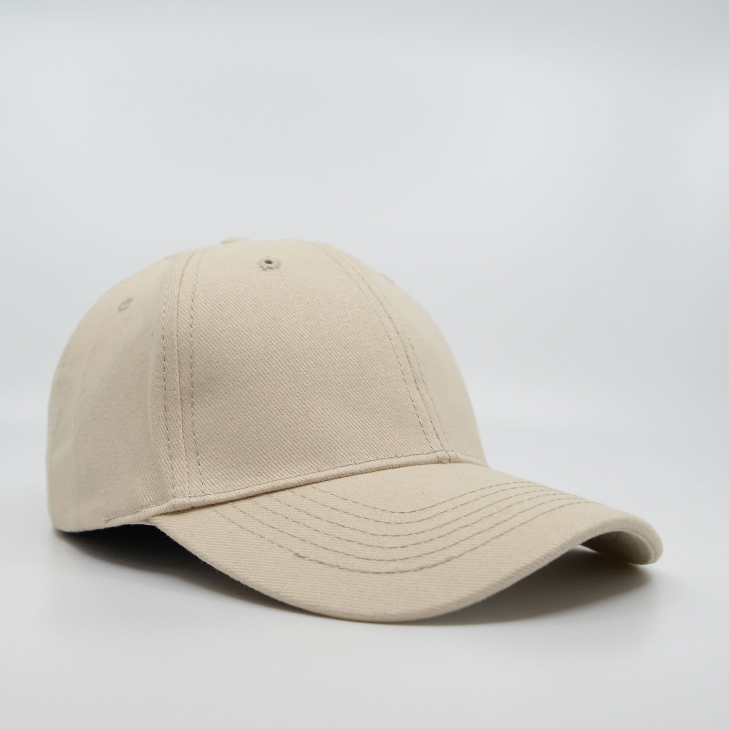 A beige 6-panel brushed cotton cap with a curved brim and a logo on the front.