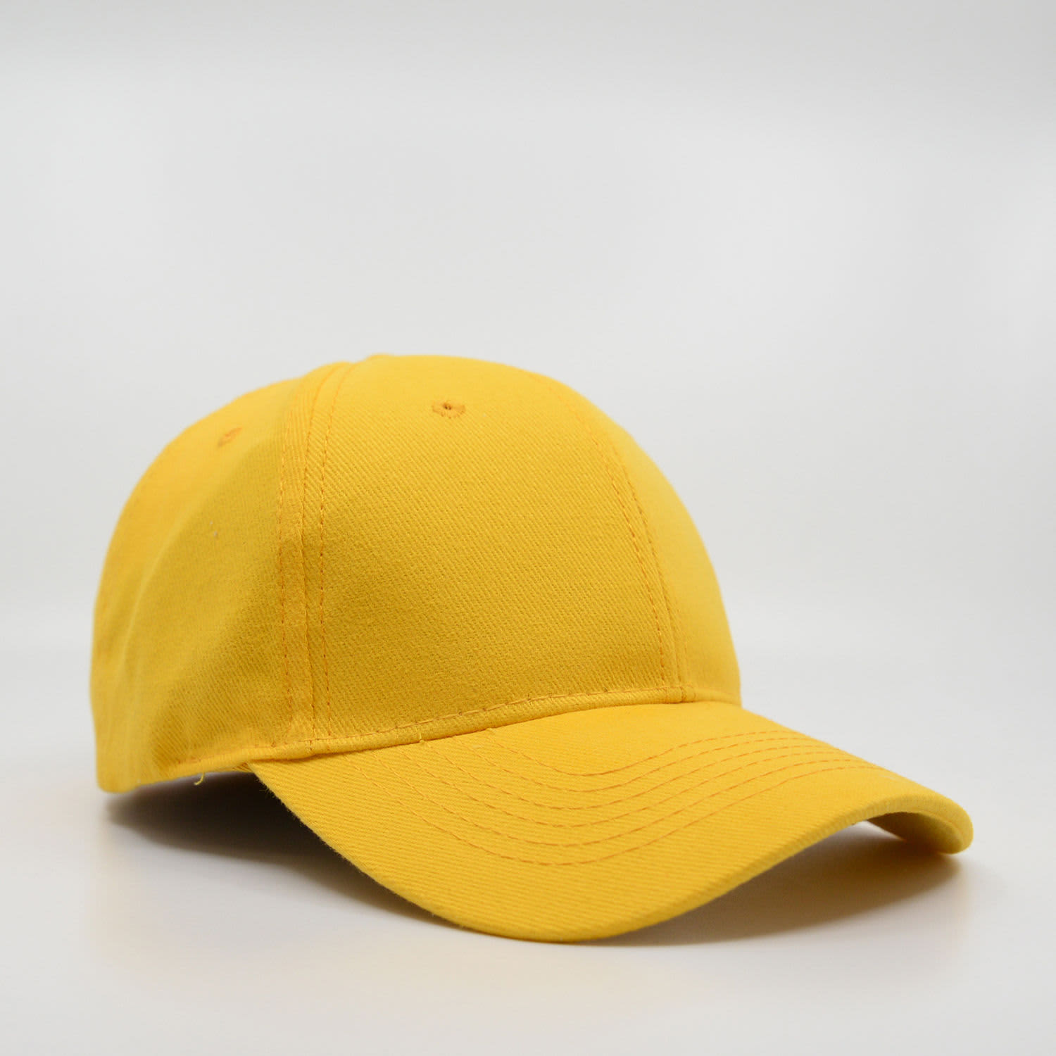 A yellow six-panel brushed cotton cap with a curved visor and stitched detailing. It features a logo on the side.