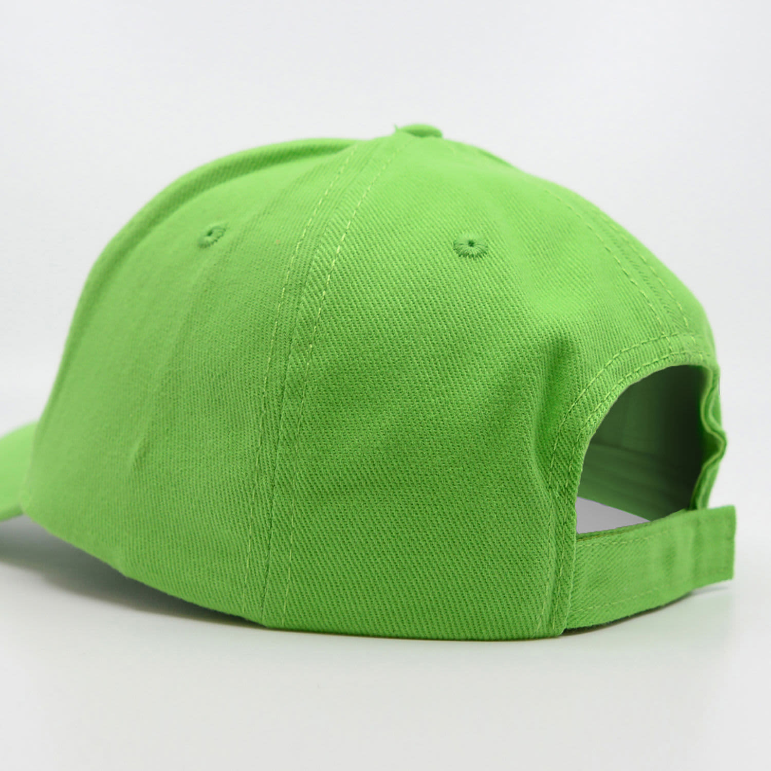 A green brushed cotton cap featuring a closed back and an adjustable strap. It includes a logo.