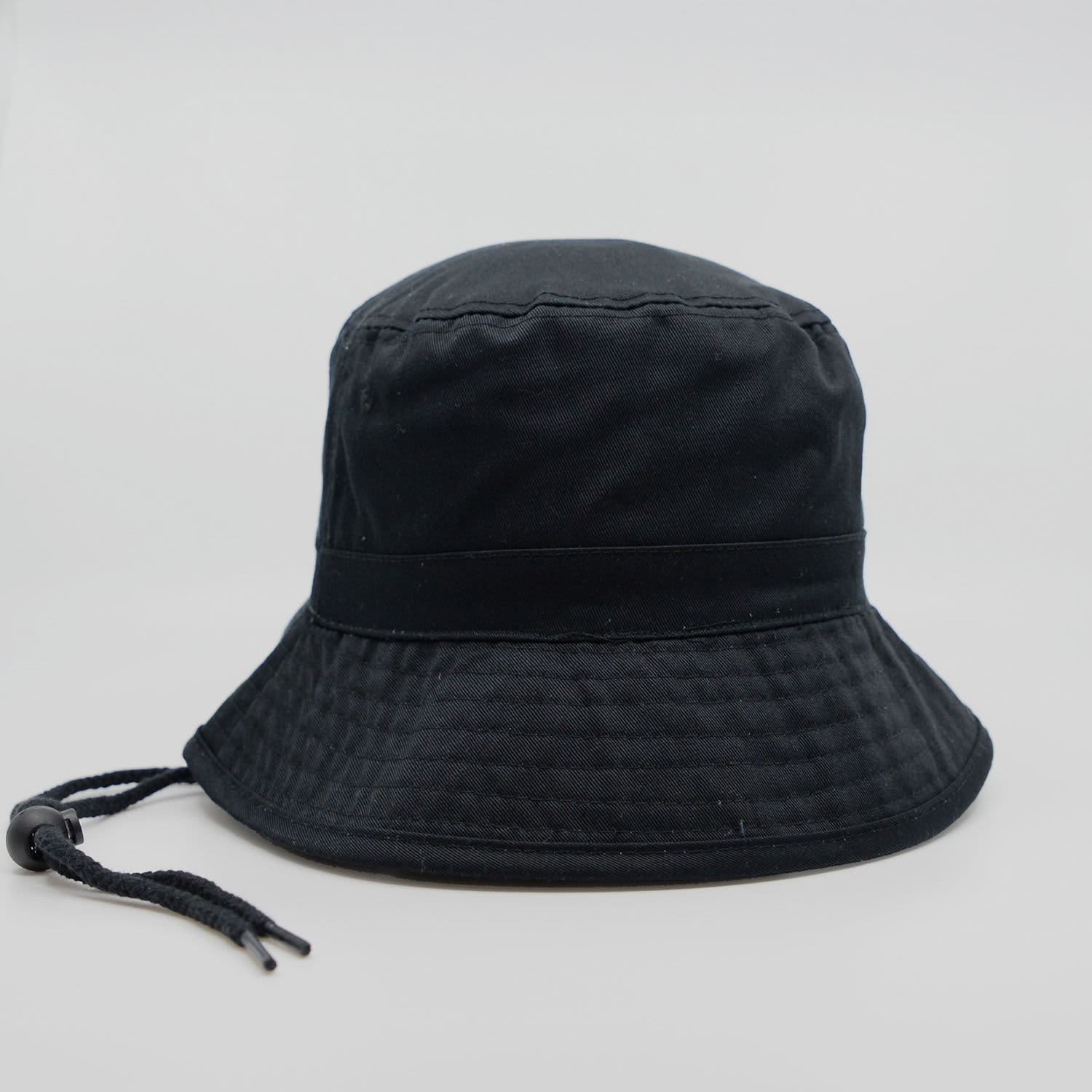 A black bucket hat with a structured brim and an adjustable chin strap. It features a subtle logo.