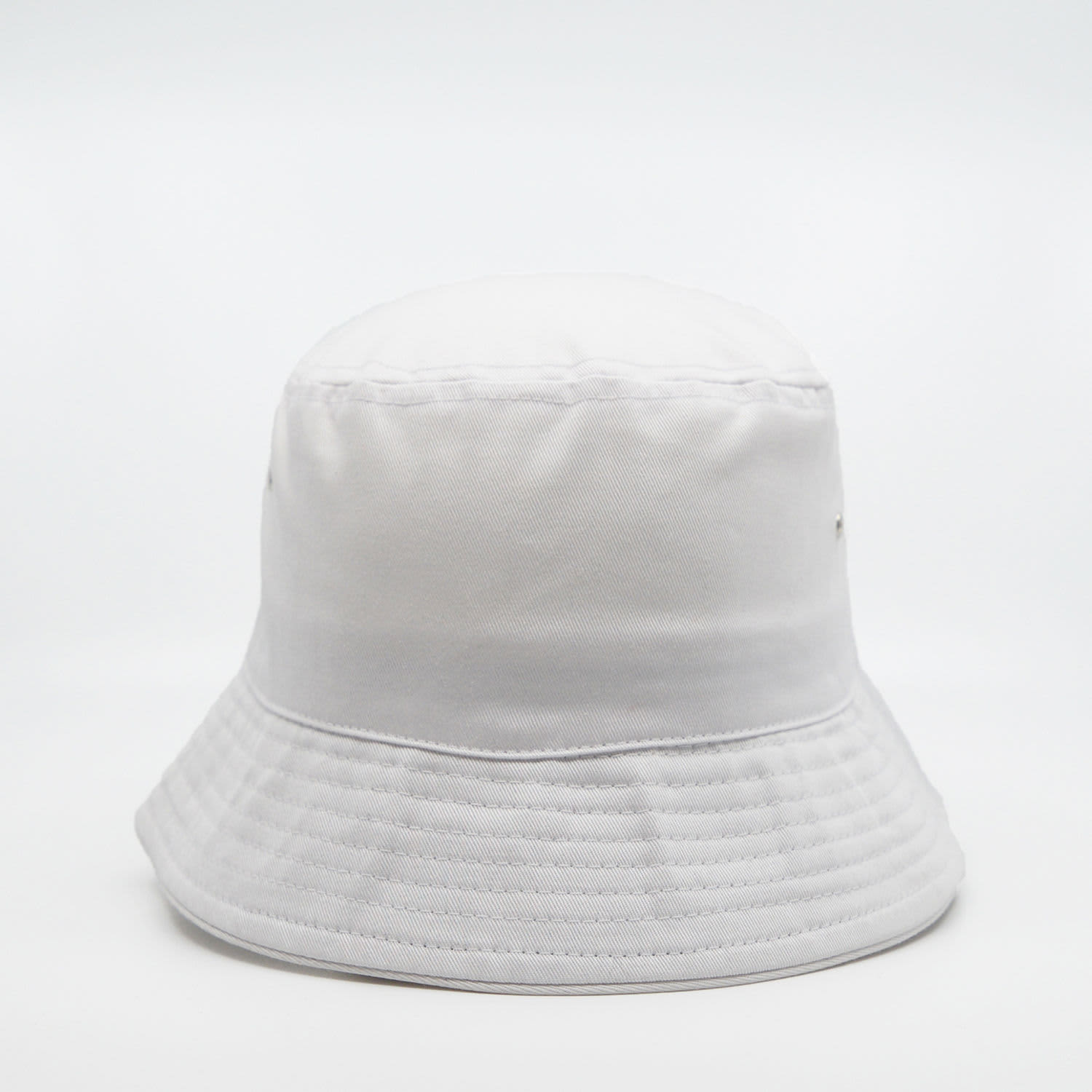 A white bucket hat with a soft crown and wide brim, featuring metal eyelets and a simple design.