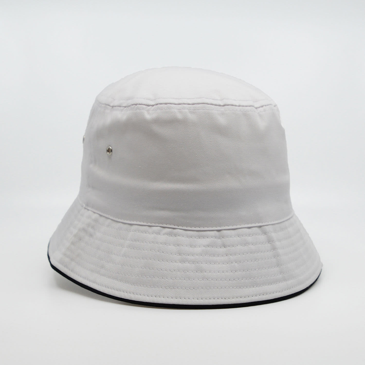 A white bucket hat with a textured surface and a contrasting black brim, featuring a logo.