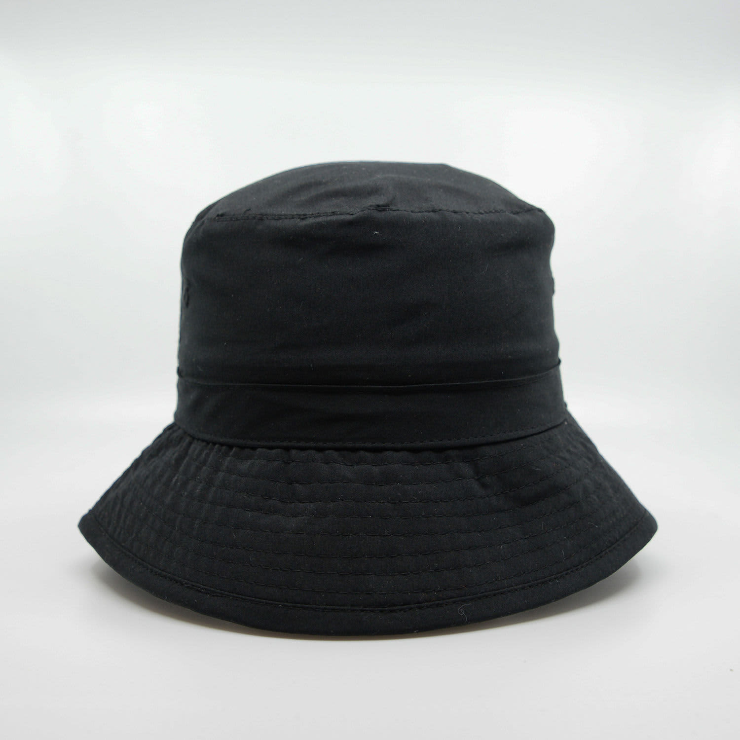 A black microfibre bucket hat with a wide brim and a textured finish, featuring a logo.