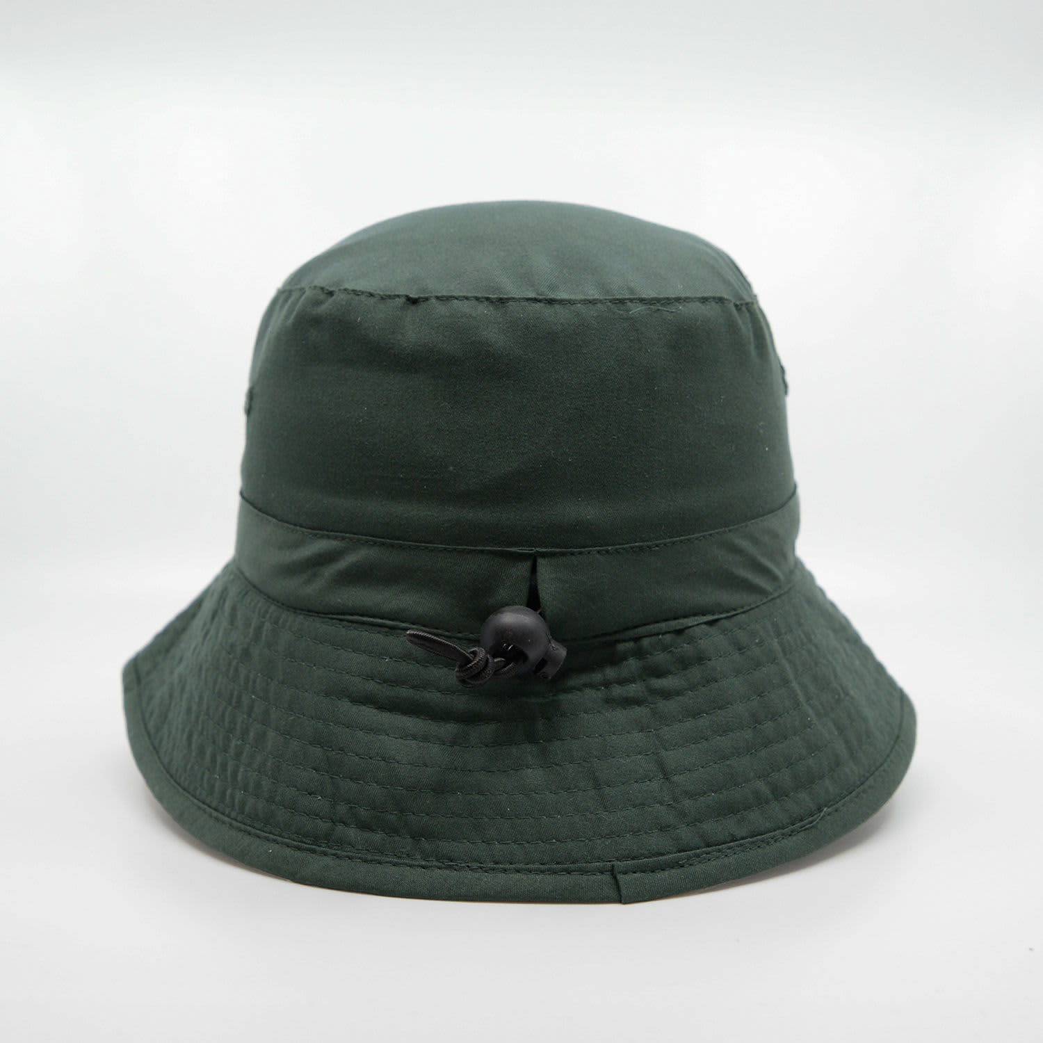 A green microfibre bucket hat with a textured finish and adjustable drawstring. It features a logo on the side.