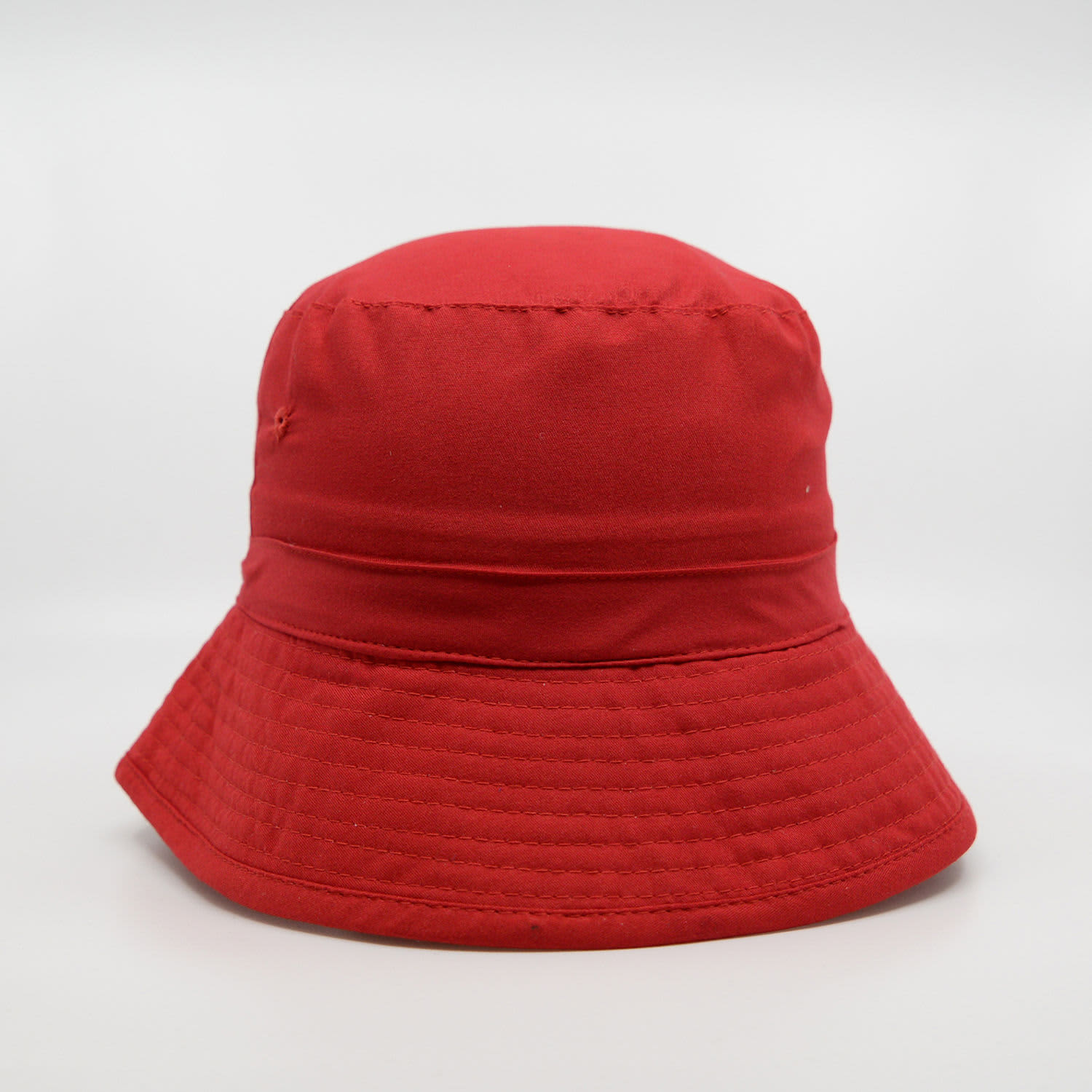 A red microfibre bucket hat with a wide brim and textured finish, featuring a small logo.