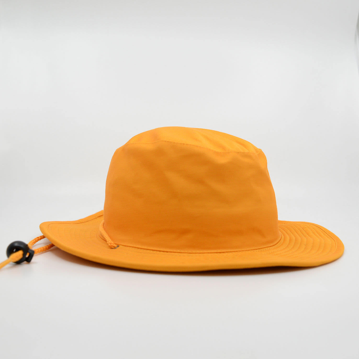 An orange wide-brimmed hat with a drawstring, featuring a branded logo.