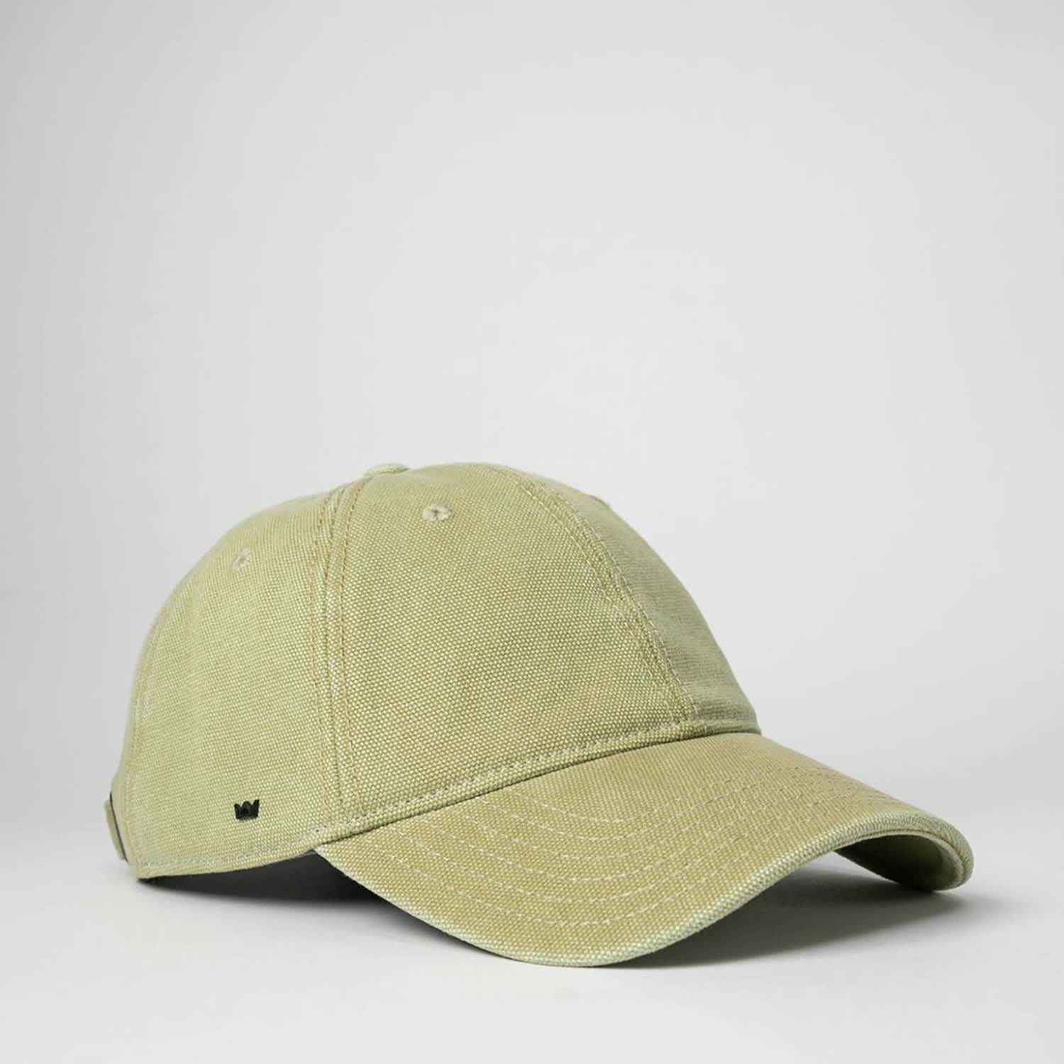A green cotton canvas unstructured six-panel cap with a small logo on the side.