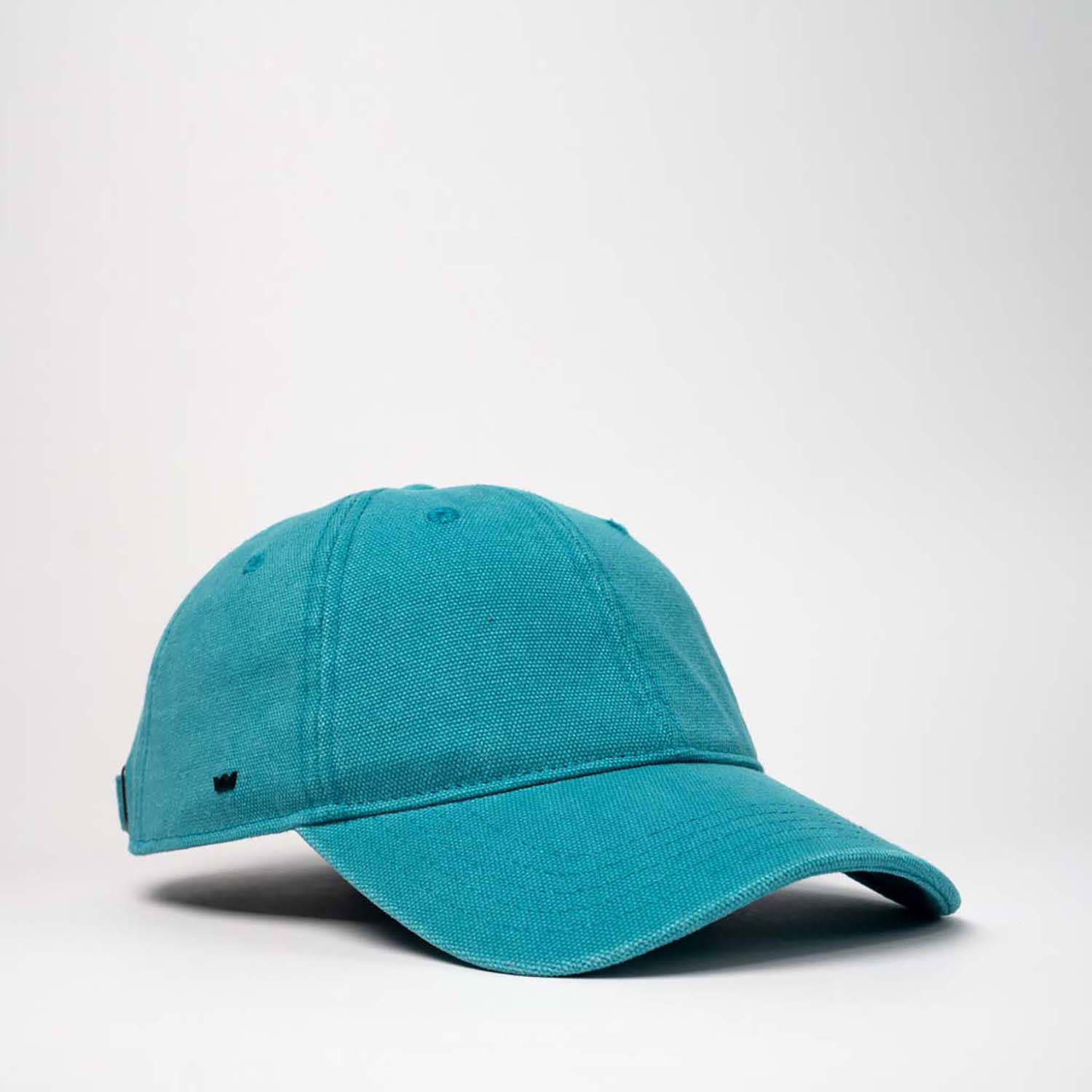 A teal cotton canvas unstructured 6 panel cap with a logo, featuring a curved brim.