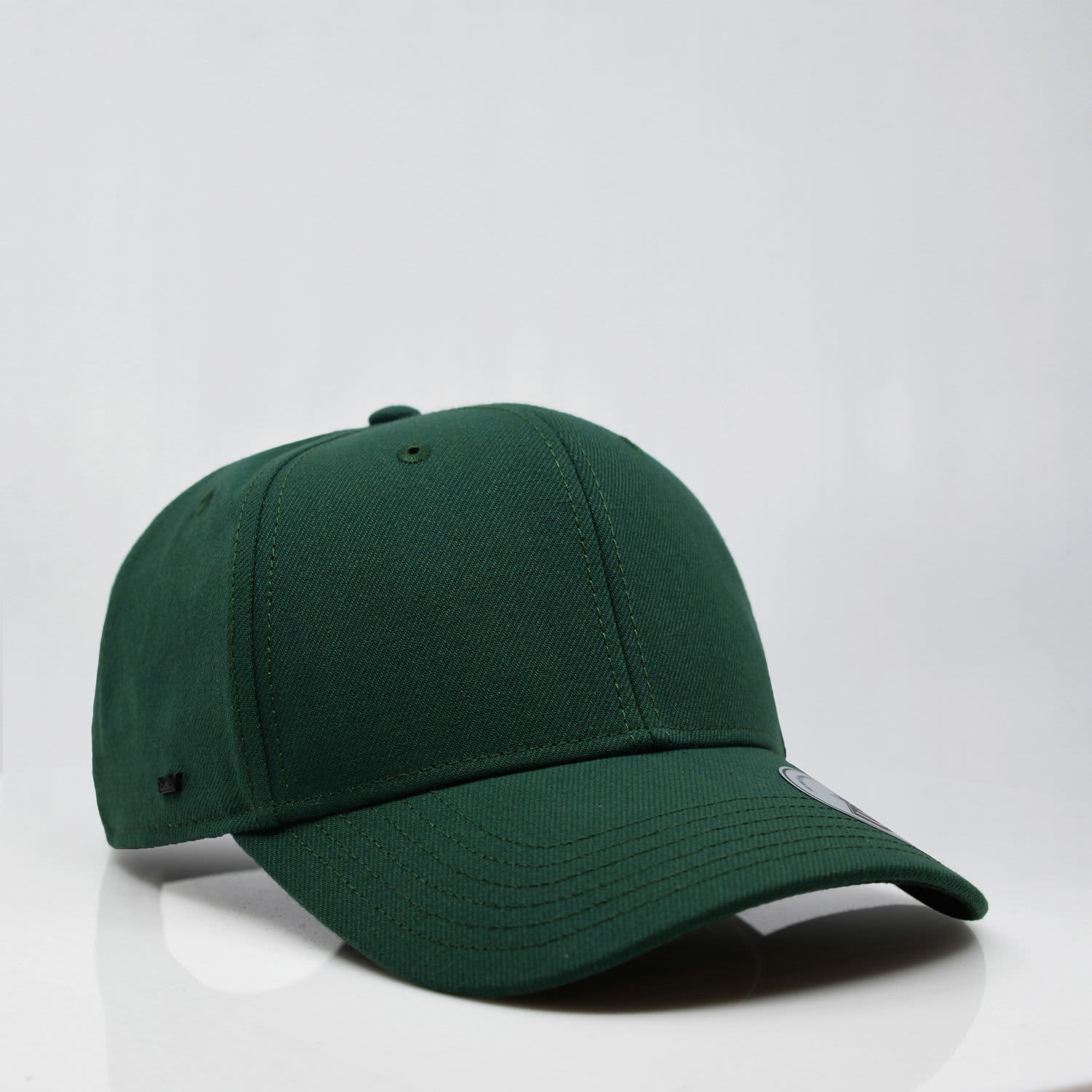 A green six-panel snapback cap featuring a logo on the side, displayed on a plain background.