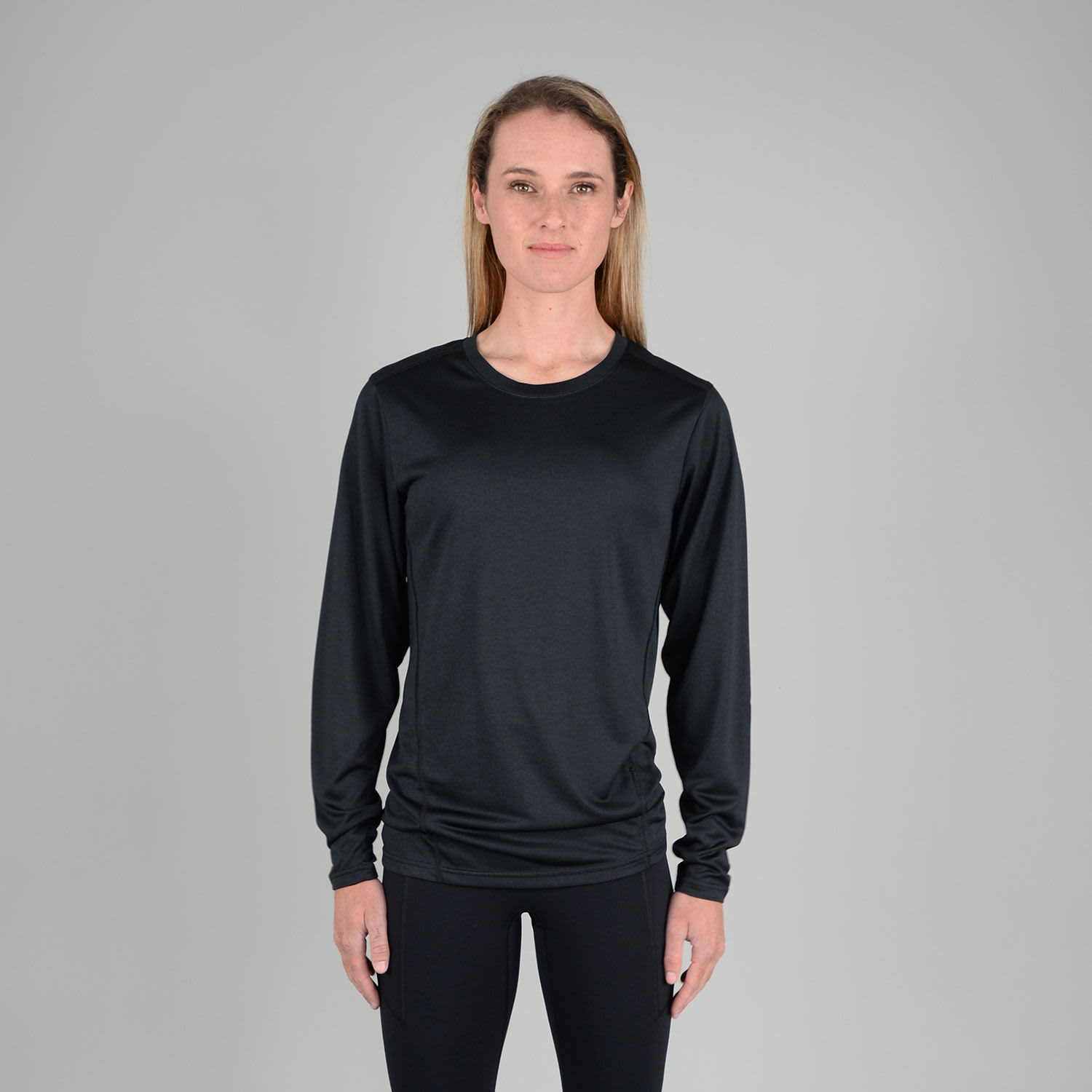 A long sleeve adult tee in black, featuring a subtle logo, with a fitted design. Ideal for active wear.