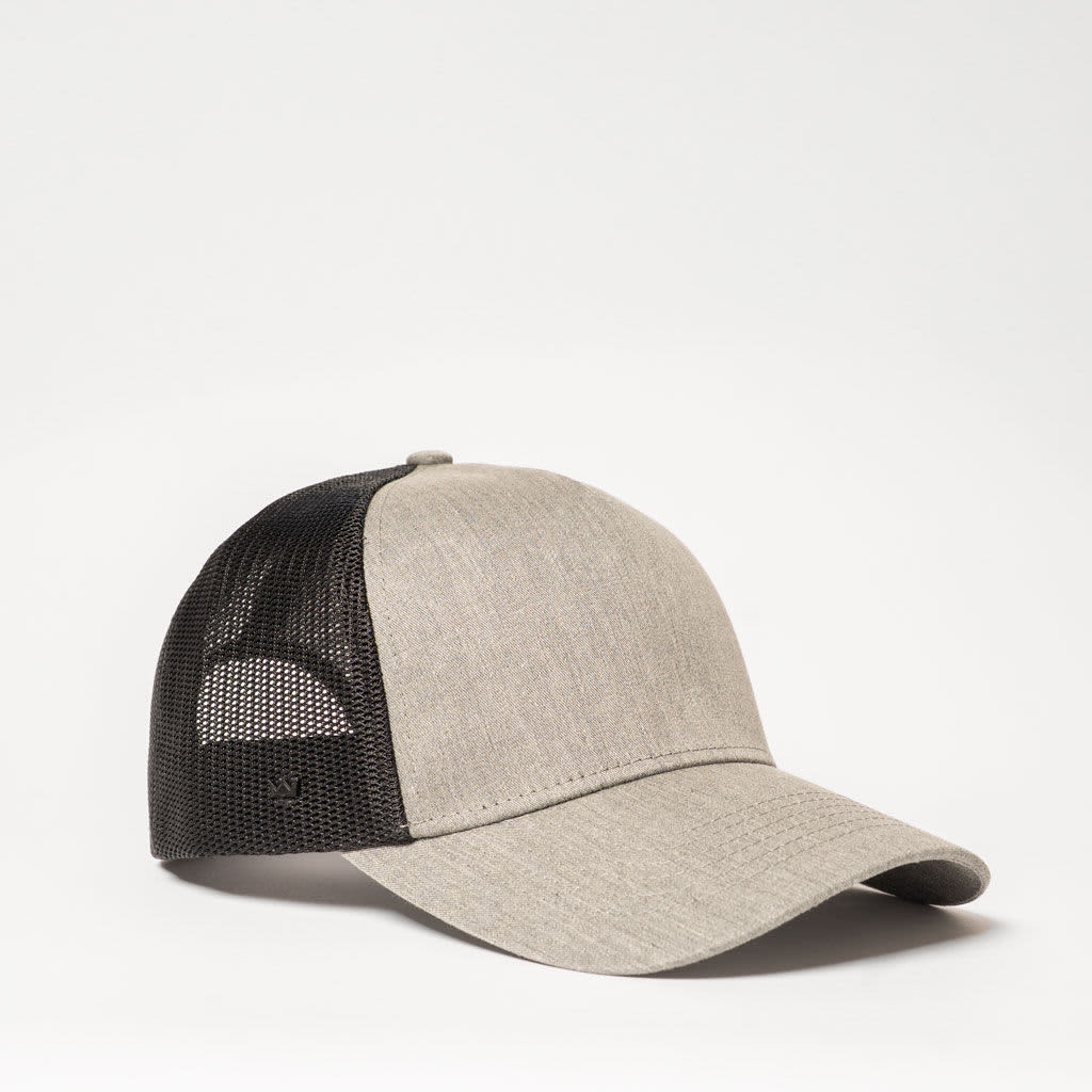 A grey and black five-panel trucker cap with a mesh back and a logo.
