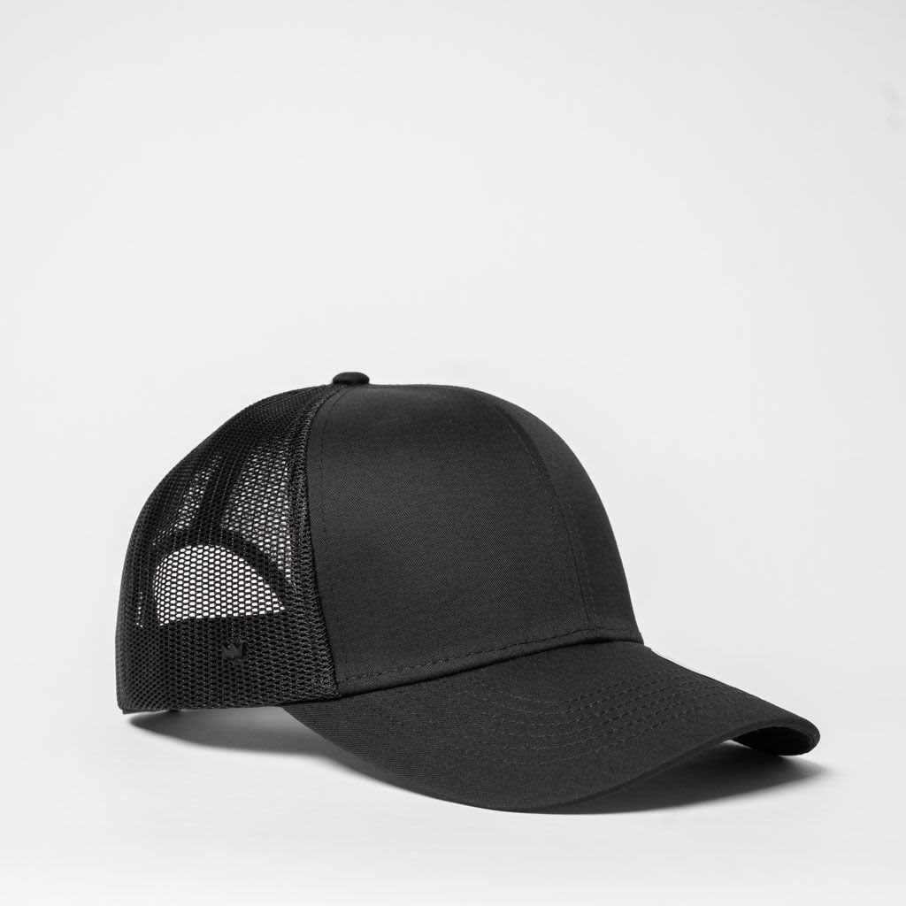 A black trucker cap featuring a six-panel design with a mesh back and a solid front.